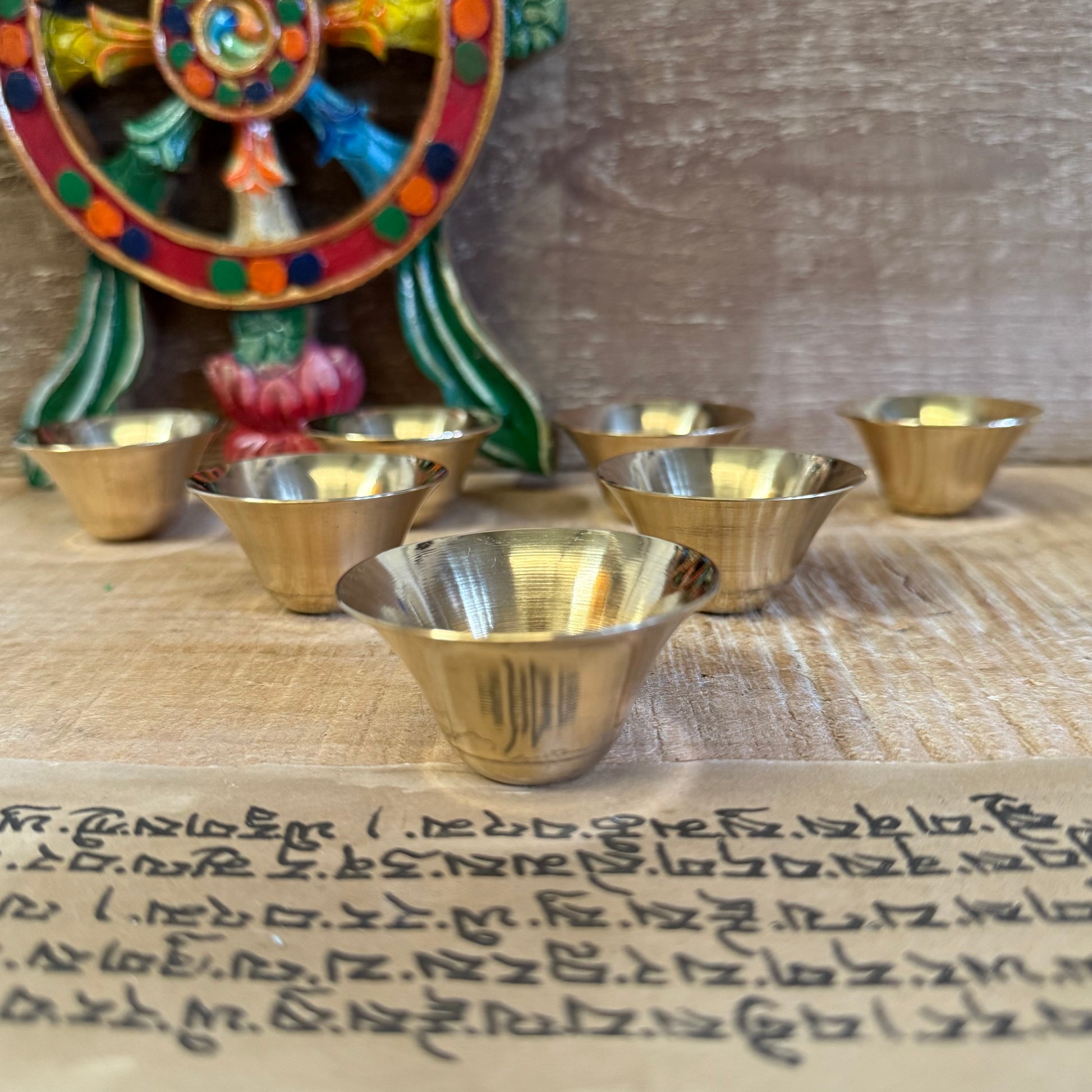 Create a sacred space of reverence and peace with this Set of 7 Small Brass Offering Bowls. In Buddhist tradition, these bowls are placed on the altar each day as symbols of generosity, purity, and devotion to the path.

Fill them with water, incense, or perfumed oil to honour the awakened ones and to cultivate inner virtues. The act of offering brings mindfulness to the heart and brings blessings to your environment.

Features:

Authentic Ritual Tool – Rooted in Tibetan and Buddhist spiritual practices

Pr