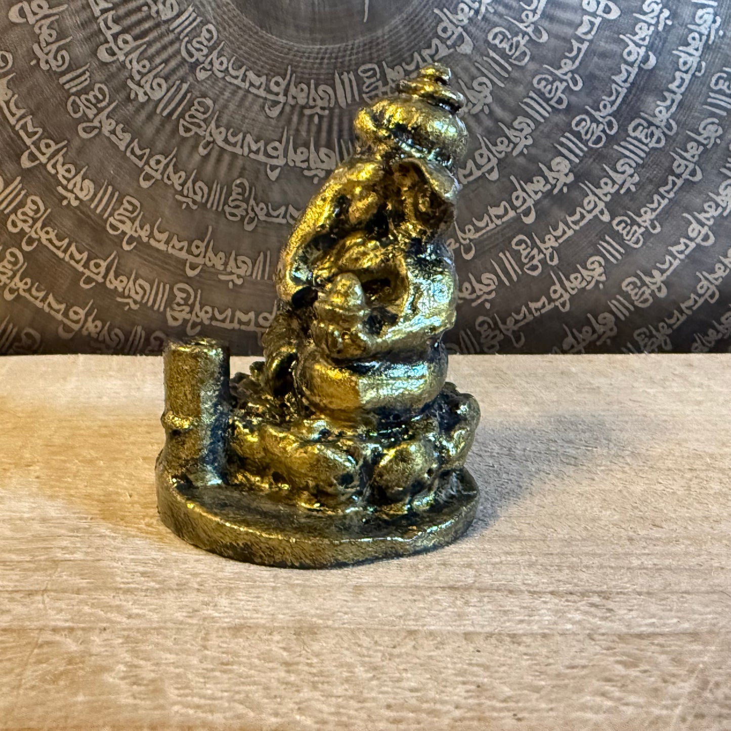 Small resin Ganesh incense holder in golden finish. Perfect for meditation, altar use, rituals, and bringing auspicious energy into your home.