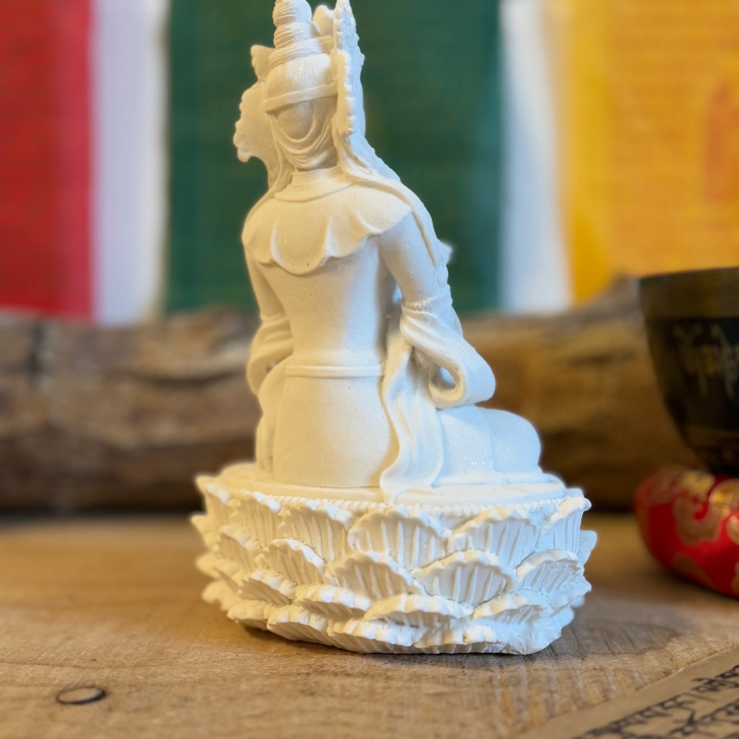 White Buddha Statue with Bell &amp; Dorje

A symbol of harmony and spirituality, this White Buddha Statue is a timeless representation of Buddhist tradition. Commonly seen in temples, this exquisite statue embodies the perfect balance of spirituality, tradition, and beauty.

Design: Standing gracefully at 17 cm, the Buddha holds a Bell and Dorje, representing wisdom and compassion—the union of profound spiritual principles.
Material: Crafted from durable polyresin, this statue combines durability with fine 