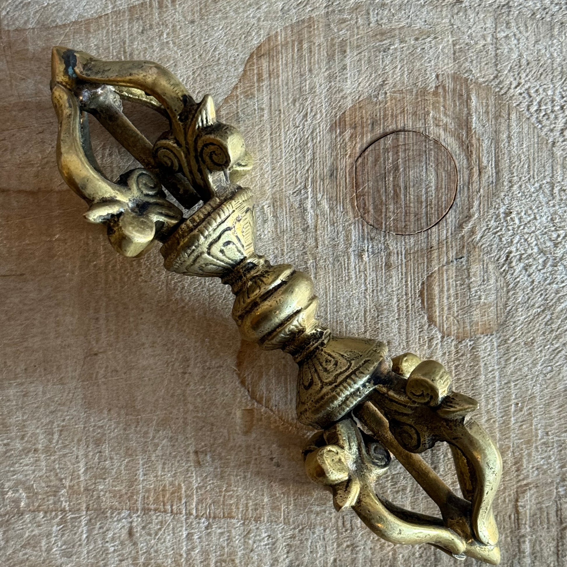 Kirtimukha Dorje vajra ritual object used in Tibetan Buddhism. Symbol of compassion, protection, and skillful action for altar or ceremony.