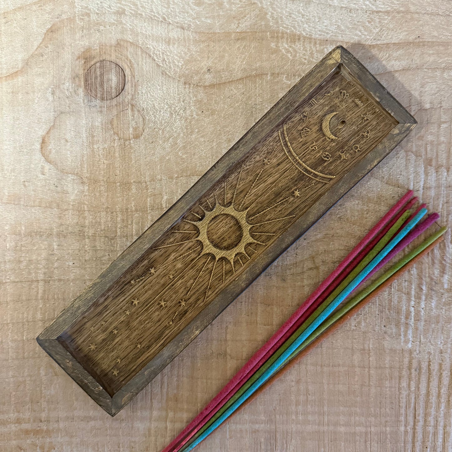 Zodiac incense holder and crystal tray in gold-stamped mango wood. A celestial ritual accessory for incense, crystals, and altar use.