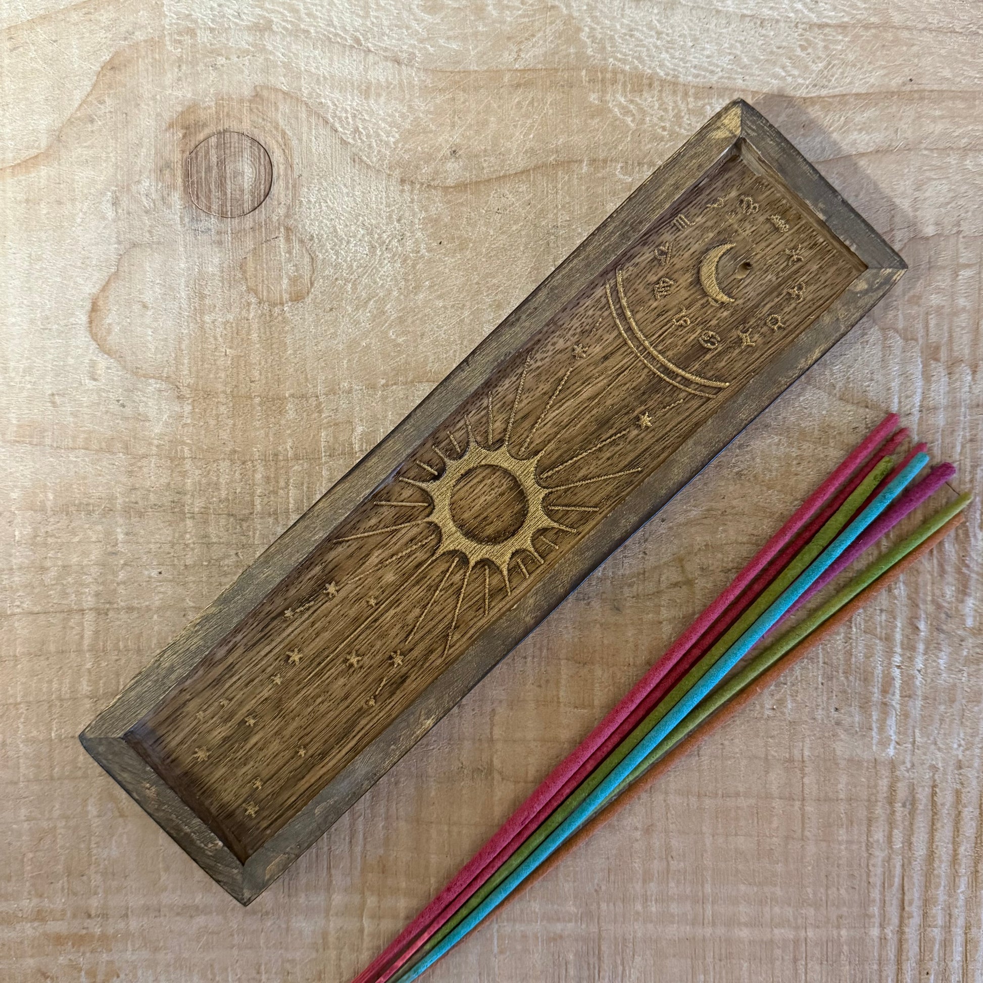 Zodiac incense holder and crystal tray in gold-stamped mango wood. A celestial ritual accessory for incense, crystals, and altar use.