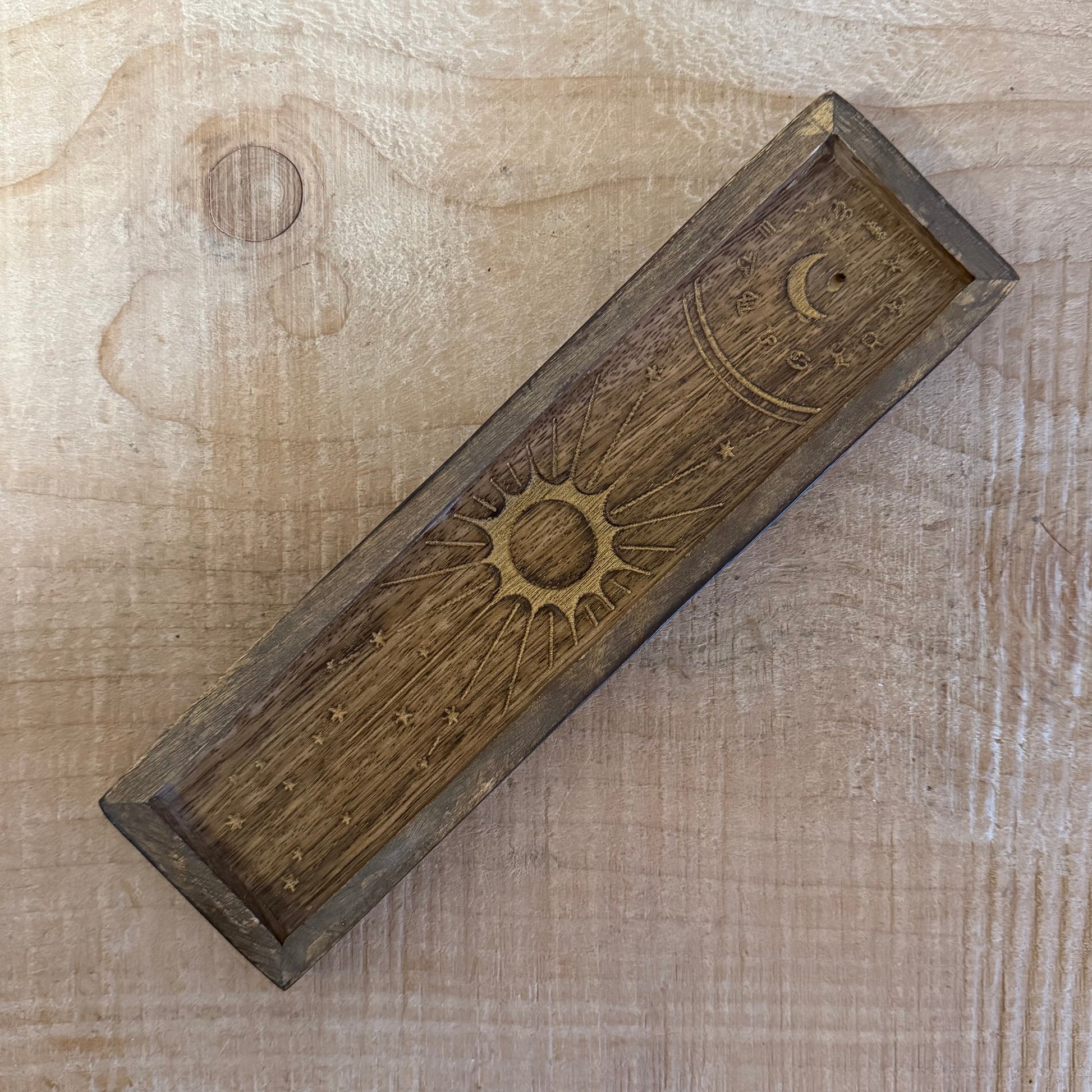 Zodiac incense holder and crystal tray in gold-stamped mango wood. A celestial ritual accessory for incense, crystals, and altar use.