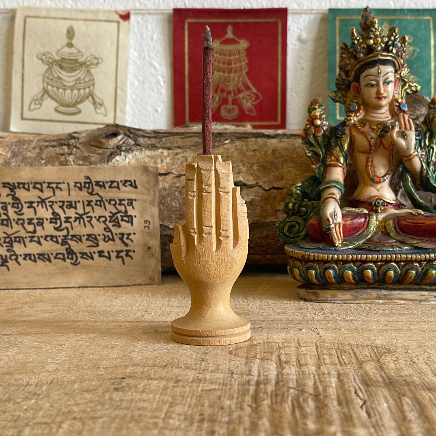 Hand carved piece of wood has been hand&nbsp;sculpted to look like hands joined together in prayer.  This intricately carved incense burner holds&nbsp;Tibetan Zimpu incense.  Approx.: 7cm High Origin: Nepal