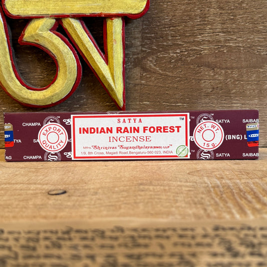Within the tranquil halls of a Buddhist temple, the fragrance of the forest drifts on the morning air. Satya Indian Rain Forest Incense carries this same serene essence into your home. Hand-rolled in India with high-quality oils, each stick captures the deep, green freshness of the rainforest — calming the mind and uplifting the spirit. This genuine Satya Sai Baba incense is perfect for meditation, prayer, or simply creating a peaceful atmosphere. Each 15g pack contains approximately 12–15 sticks, crafted w