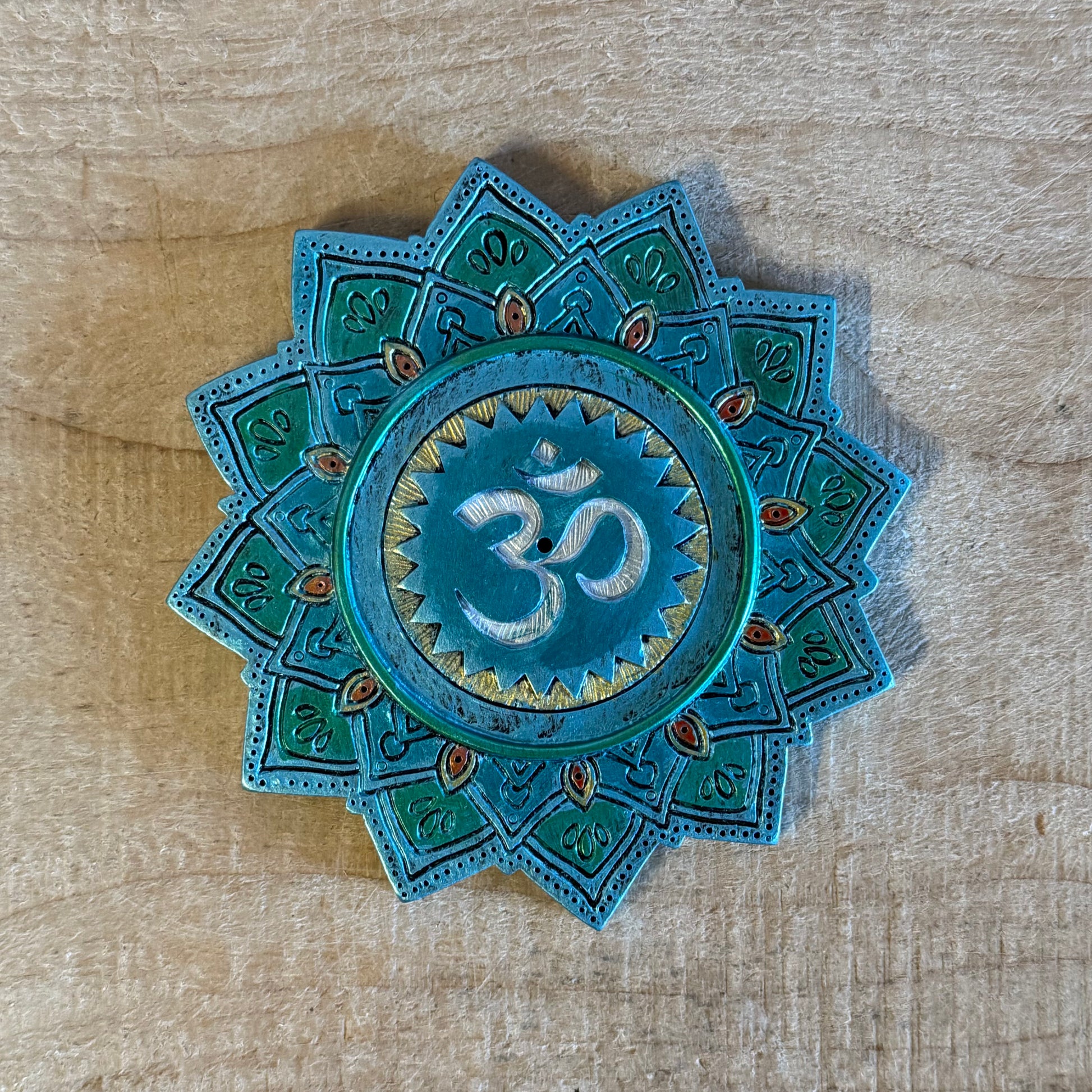 Om sacred sound incense burner made from hand-painted resin. Spiritual incense holder for meditation, chanting, altars, and mindful rituals.