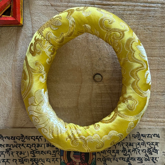 18cm Singing Bowl Cushion – Brocade Ring for Singing Bowls

Elegant 18cm doughnut cushion cradles singing bowls in style. Ideal for healers & spiritual practice. Fits small to medium bowls. Shop at Buddha-Buddha.com.