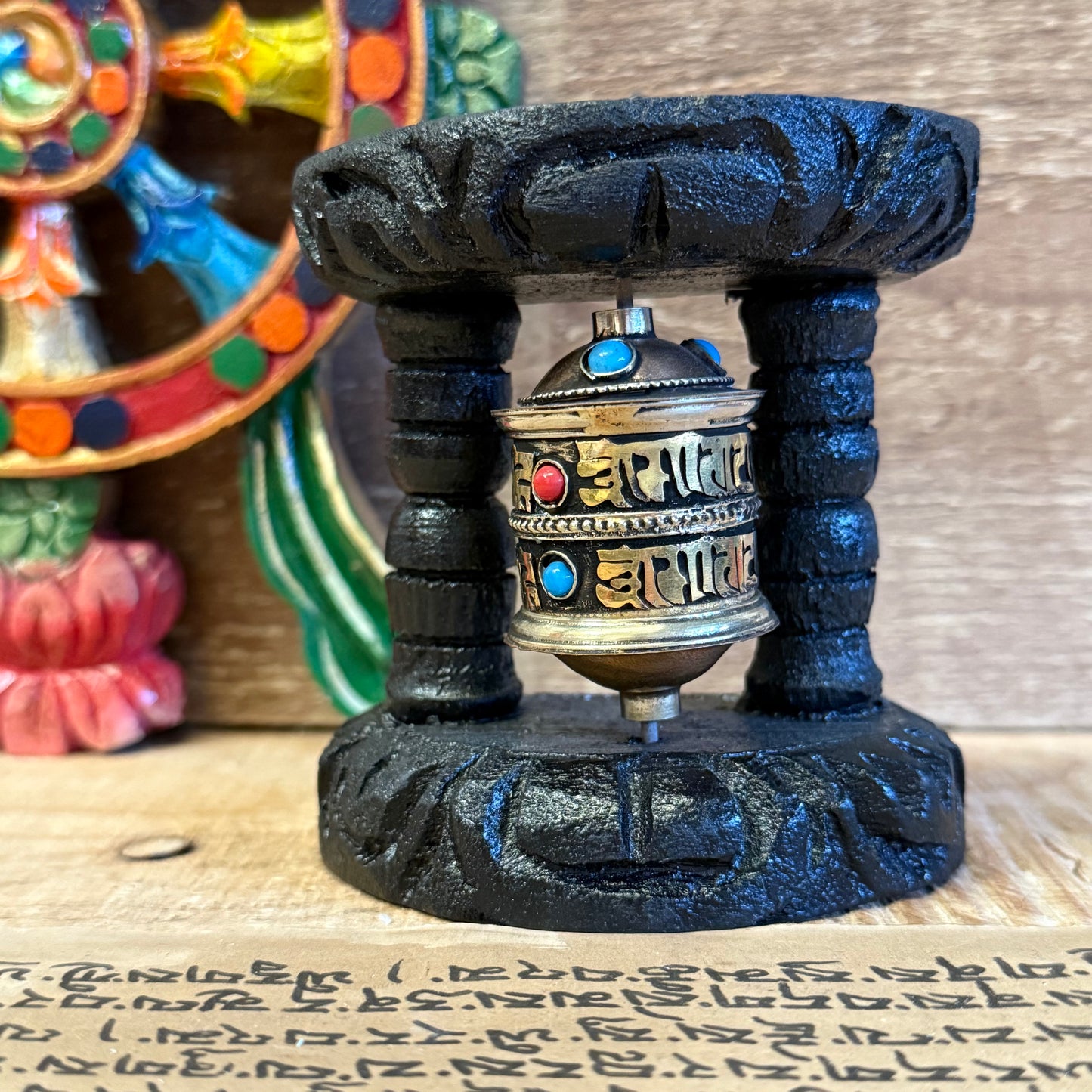 Wall Mounted Prayer Wheel | Small Handcrafted Buddhist Wheel

Small wall-mounted prayer wheel filled with Om Mani Padme Hum. Handmade in Nepal. A sacred addition to your altar, entranceway, or meditation space.