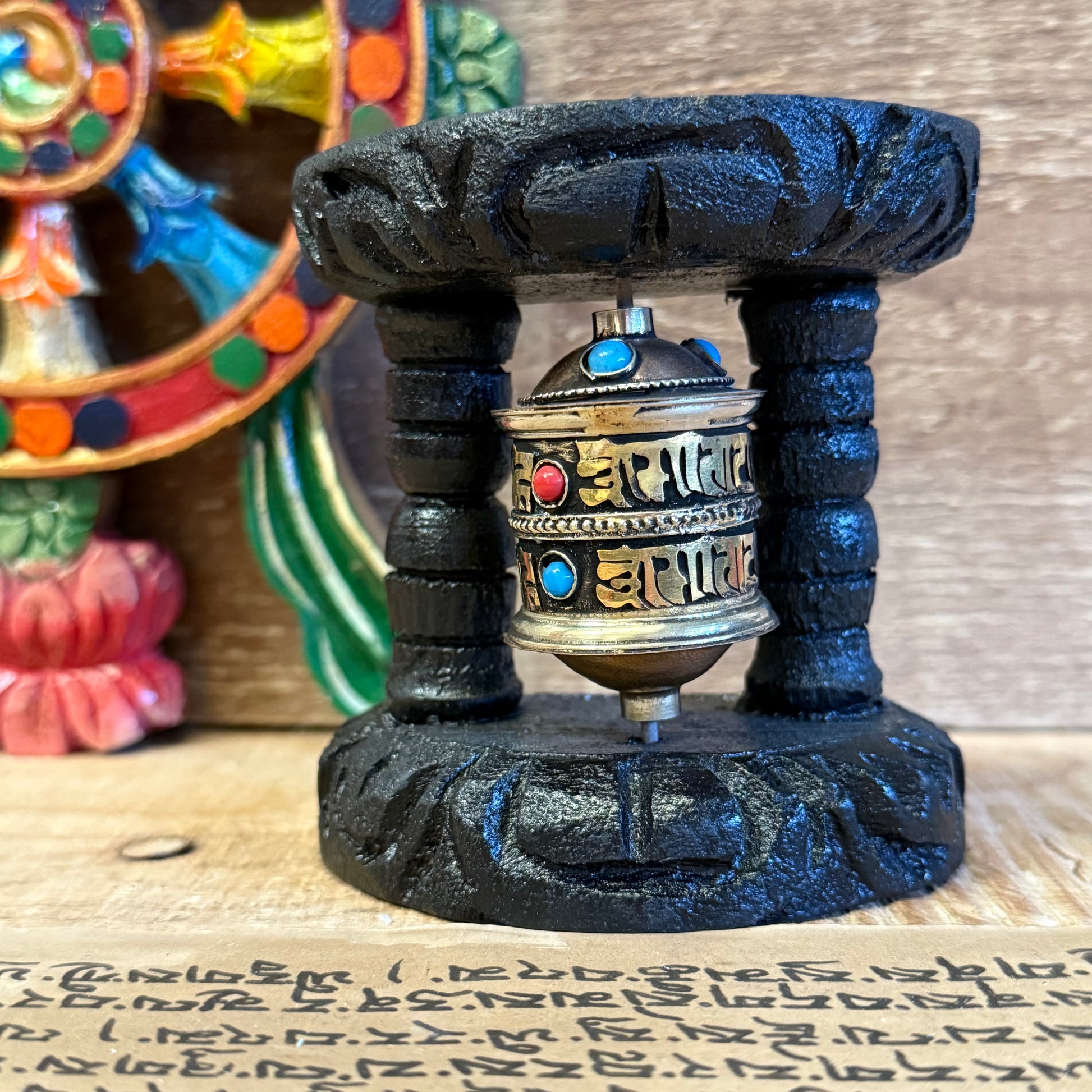Wall Mounted Prayer Wheel | Small Handcrafted Buddhist Wheel

Small wall-mounted prayer wheel filled with Om Mani Padme Hum. Handmade in Nepal. A sacred addition to your altar, entranceway, or meditation space.