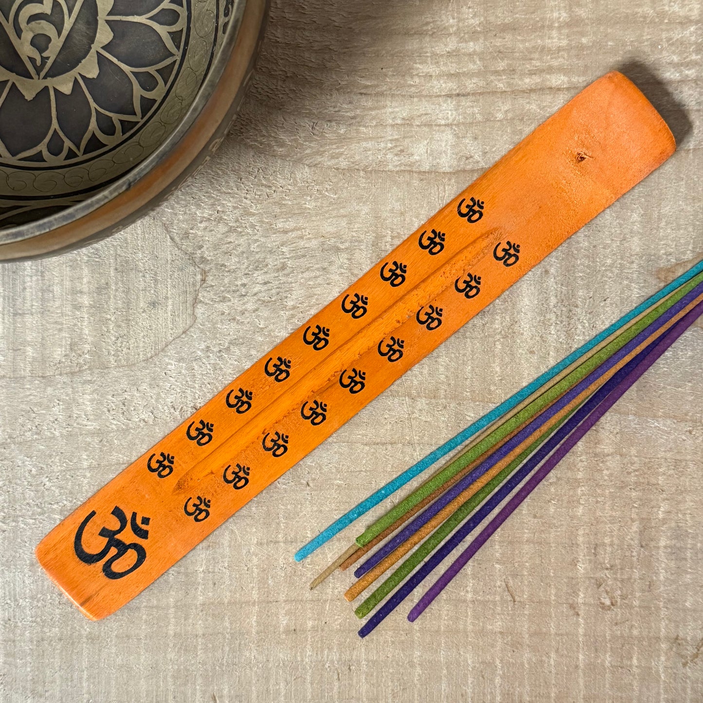 Handcrafted wooden incense holder with Om design for meditation, spiritual rituals, and mindful incense burning.