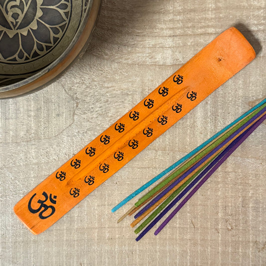 Handcrafted wooden incense holder with Om design for meditation, spiritual rituals, and mindful incense burning.