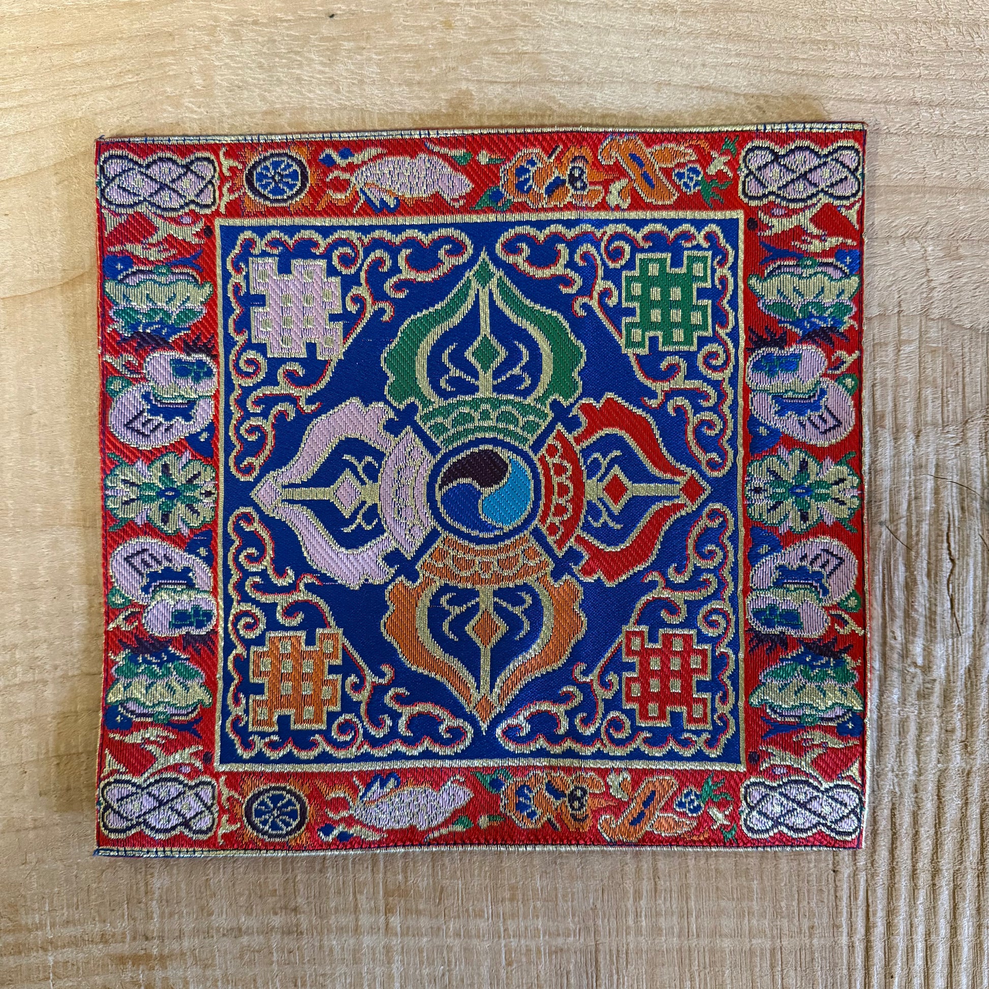 Handmade Tibetan altar cloth with Double Dorje embroidery. Ideal for meditation, singing bowls, altars, and sacred spaces. 22 x 22 cm silk brocade.