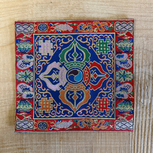 Handmade Tibetan altar cloth with Double Dorje embroidery. Ideal for meditation, singing bowls, altars, and sacred spaces. 22 x 22 cm silk brocade.