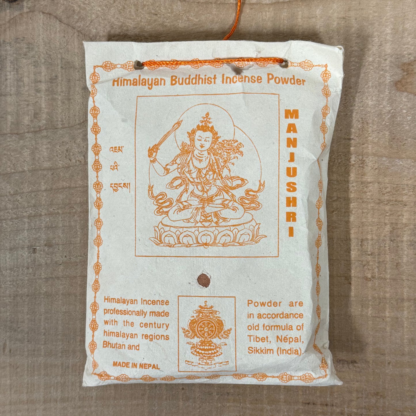 Himalayan Manjushri incense powder wrapped in traditional Lokta paper