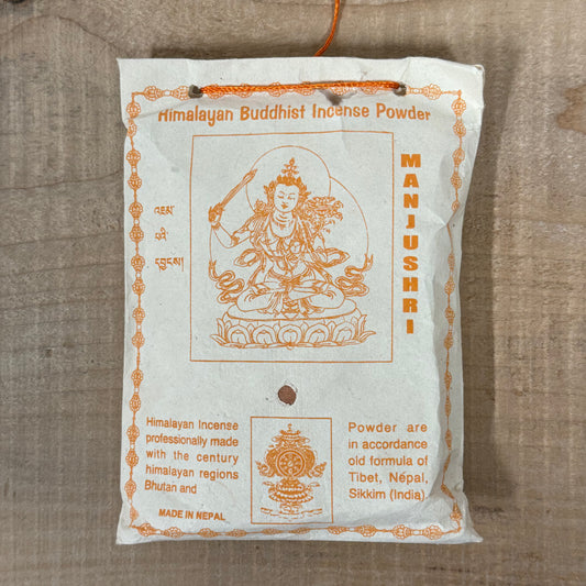 Himalayan Manjushri incense powder wrapped in traditional Lokta paper