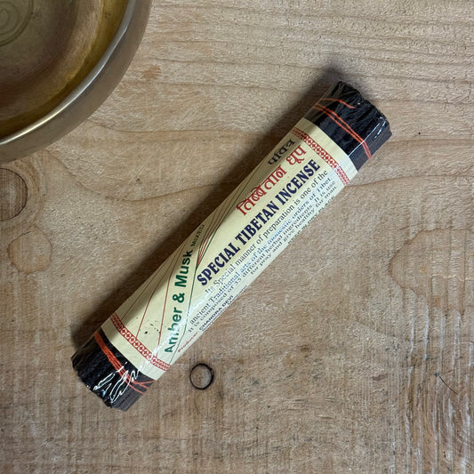 Beloved friend on the path, the Chandra Devi Amber &amp; Musk Tibetan Incense is a fragrant embodiment of the sacred balance between earth and spirit. Prepared with devotion in accordance with an ancient Tibetan monastic recipe, it combines amber, musk, and over 33 healing herbs into a deeply grounding yet subtly sweet aromatic experience.

The scent unfolds slowly—first, the warm, honey-like sweetness of amber arises. Then, the earthy, grounding notes of musk follow, anchoring your awareness and calming th