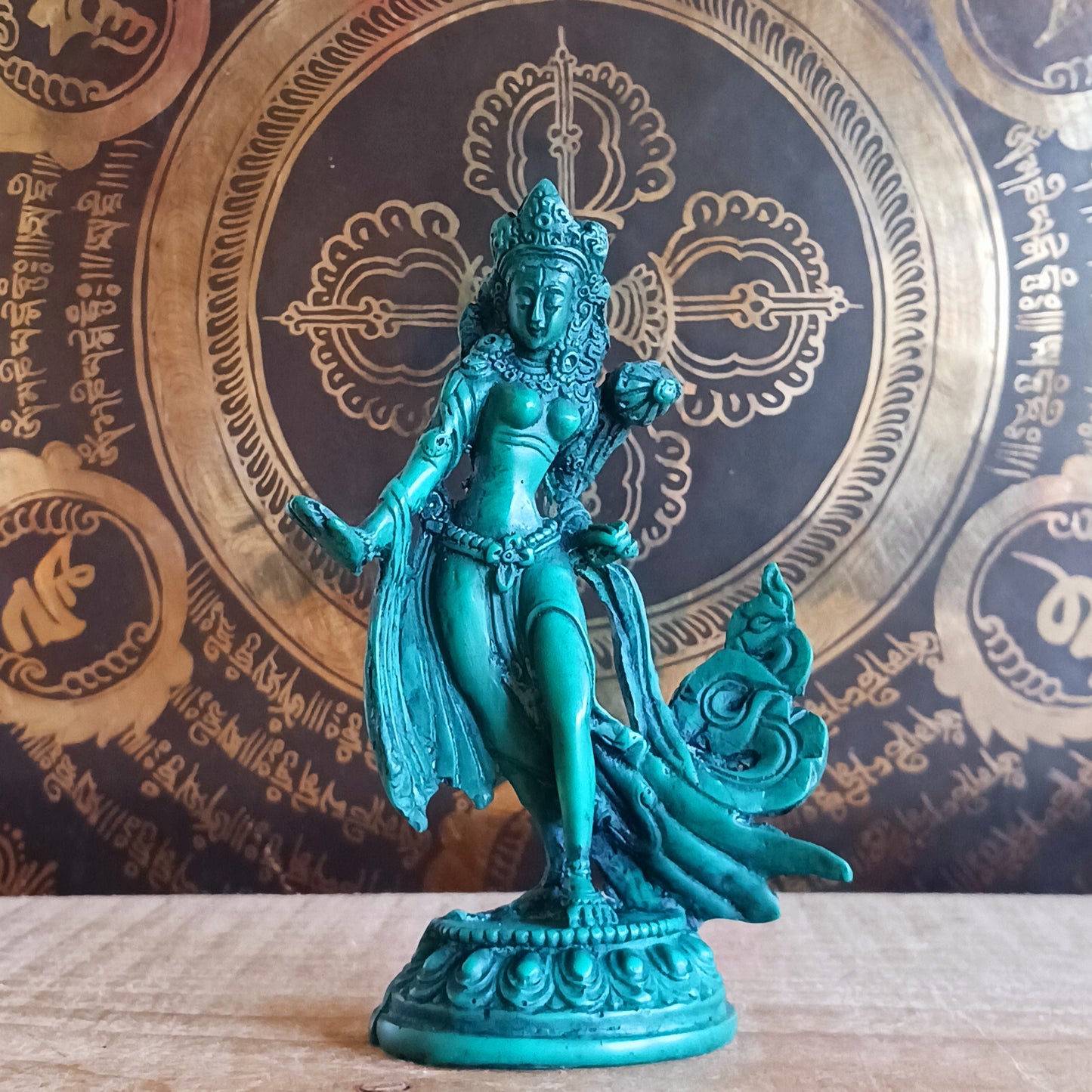 Honour the presence of compassion, protection, and enlightened wisdom with this beautifully hand-painted resin statue of Green Tara. Representing one of the 21 revered forms of Tara, this statue depicts her in a graceful standing posture, hands in the varada mudra—the gesture of generosity, blessing, and compassionate offering.