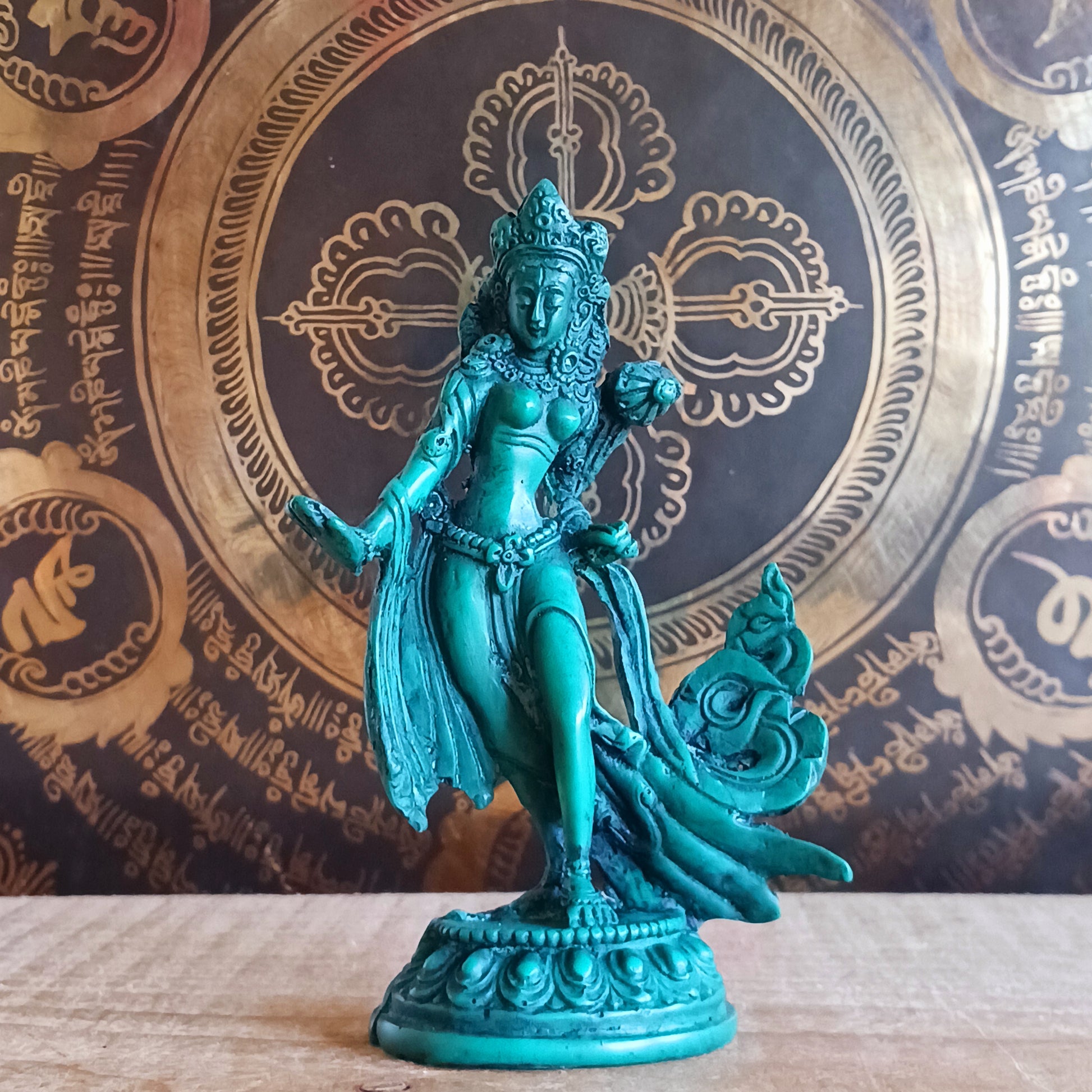 Honour the presence of compassion, protection, and enlightened wisdom with this beautifully hand-painted resin statue of Green Tara. Representing one of the 21 revered forms of Tara, this statue depicts her in a graceful standing posture, hands in the varada mudra—the gesture of generosity, blessing, and compassionate offering.