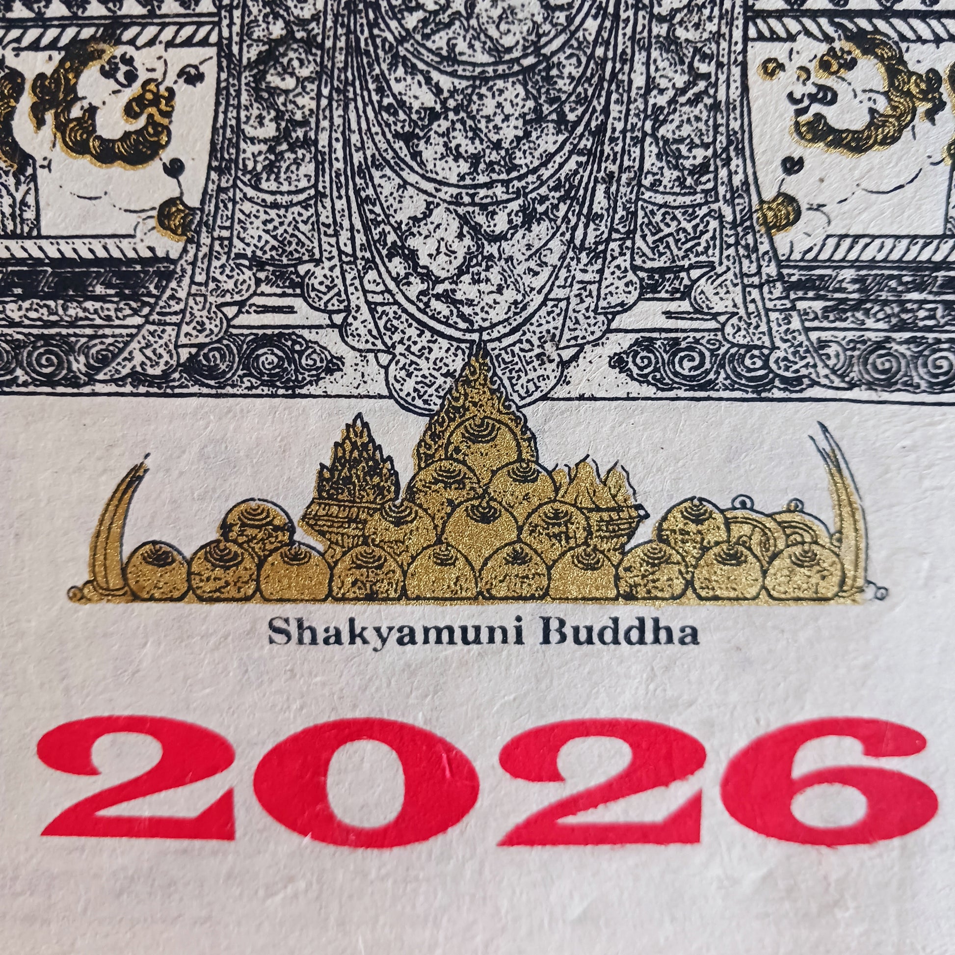 Bring the beauty, wisdom, and serenity of Buddhist art into your home with this handmade Lokta paper wall calendar, featuring seven revered Buddhist deities illustrated in traditional Thangka style. Each page showcases one of the following sacred figures: