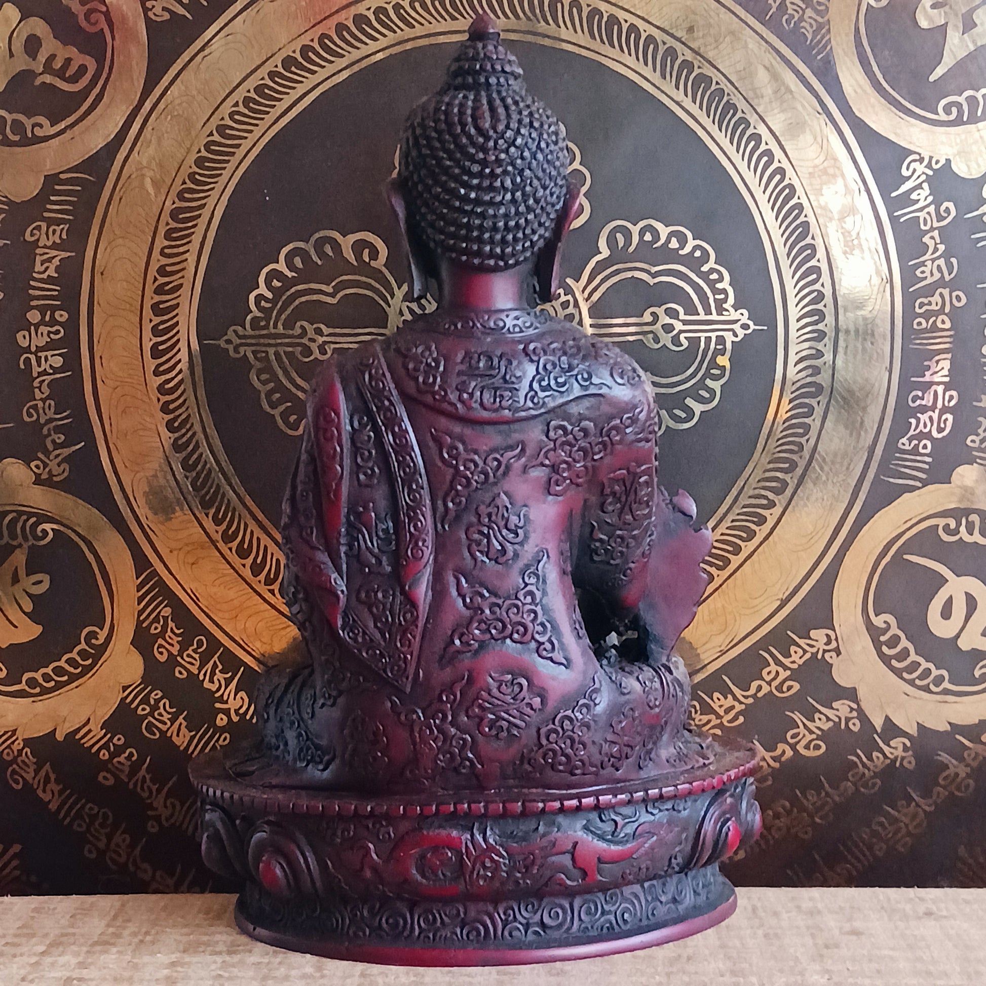 Bring the serene power of healing into your space with this large Medicine Buddha statue. Crafted in a deep, rich red colour with intricate detailing, this sculpture represents Bhaisajya Tathagatta, also known as the Healing Buddha.