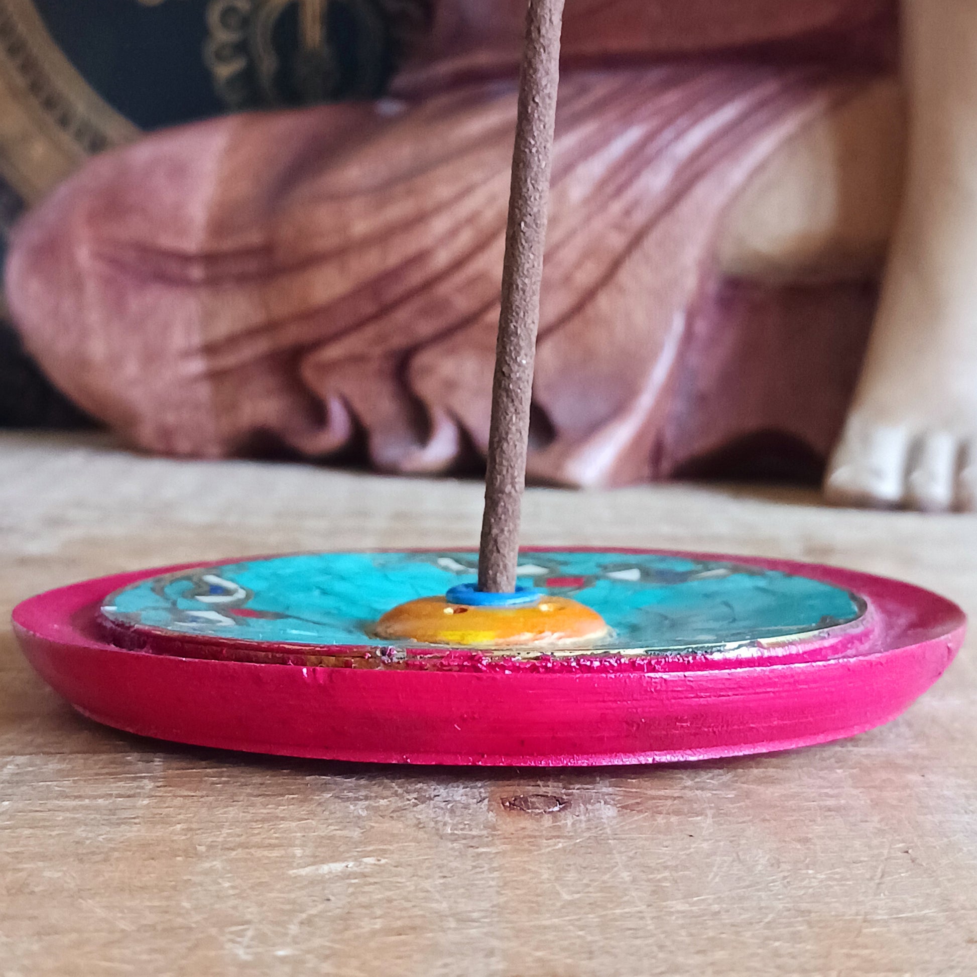 Bring a sense of peace and sacred beauty to your space with this handcrafted Tibetan Incense Holder featuring the iconic Buddha Eye design. Skilfully adorned with turquoise stone chip inlay, each piece carries a touch of Himalayan artistry and spiritual symbolism.