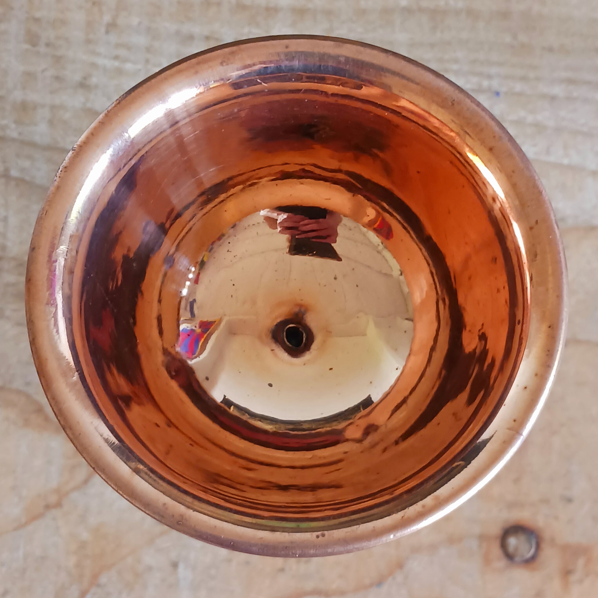 Illuminate your spiritual practice with this fine Traditional Tibetan Butter Lamp, handcrafted from high-quality copper and adorned with intricate Auspicious Symbols. These sacred lamps are a central element in Tibetan Buddhist rituals, symbolizing the light of wisdom dispelling the darkness of ignorance. Commonly found in Himalayan temples and monasteries, butter lamps are offered each morning by Tibetan Buddhists.