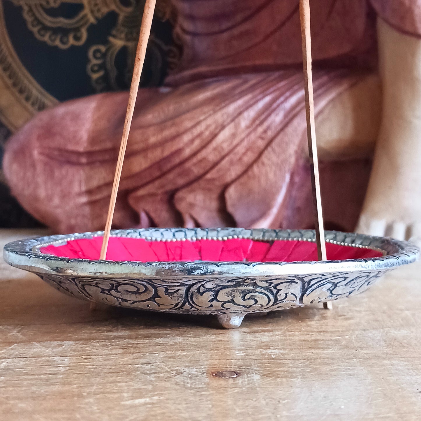 This handcrafted masterpiece transcends its function as a simple burner; it's a visual representation of the sacred syllable Om, a powerful symbol of peace, unity, and the interconnectedness of all things.