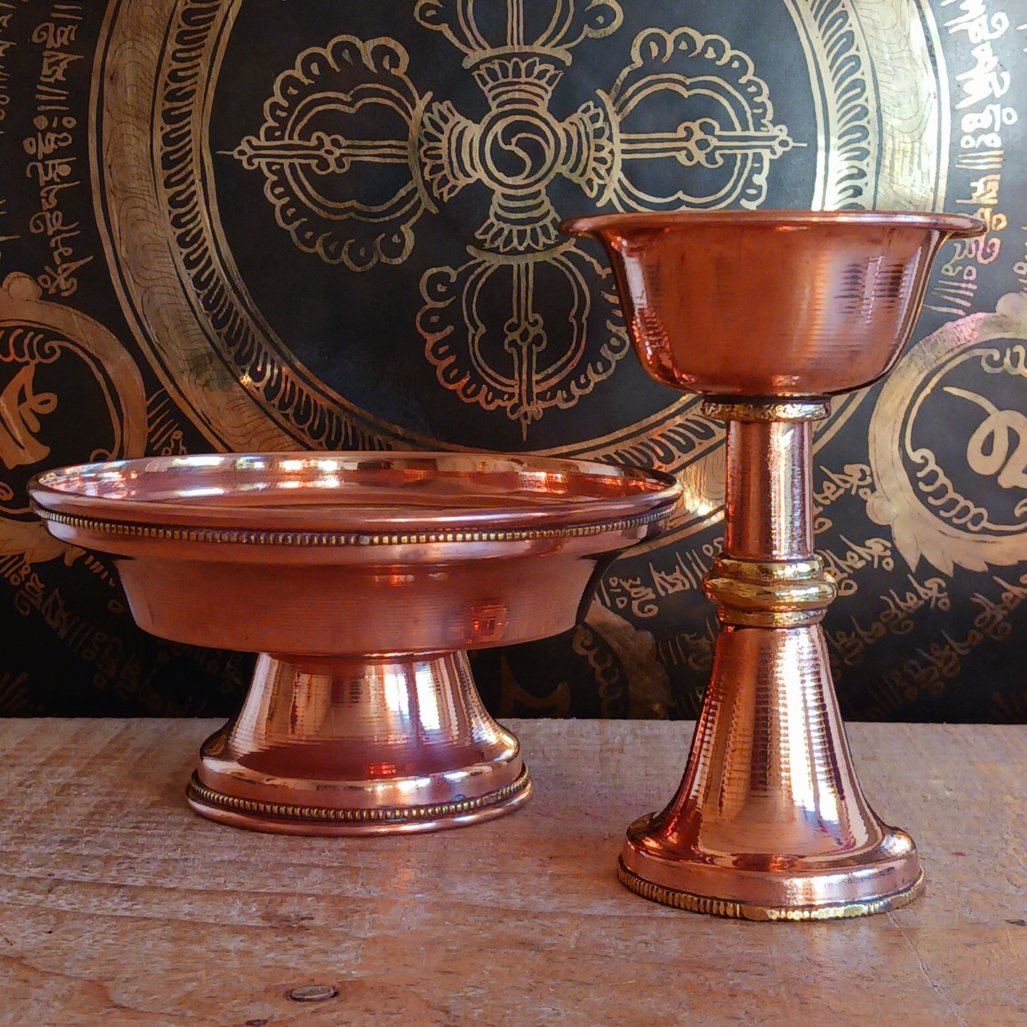 Immerse yourself in the sacred traditions of Tibetan Buddhism with this Traditional Tibetan Buddhist Copper Serkyem Set. Expertly crafted from high-quality copper, this ritual offering set is an essential tool used during pujas, deity offerings, and ceremonial practices.