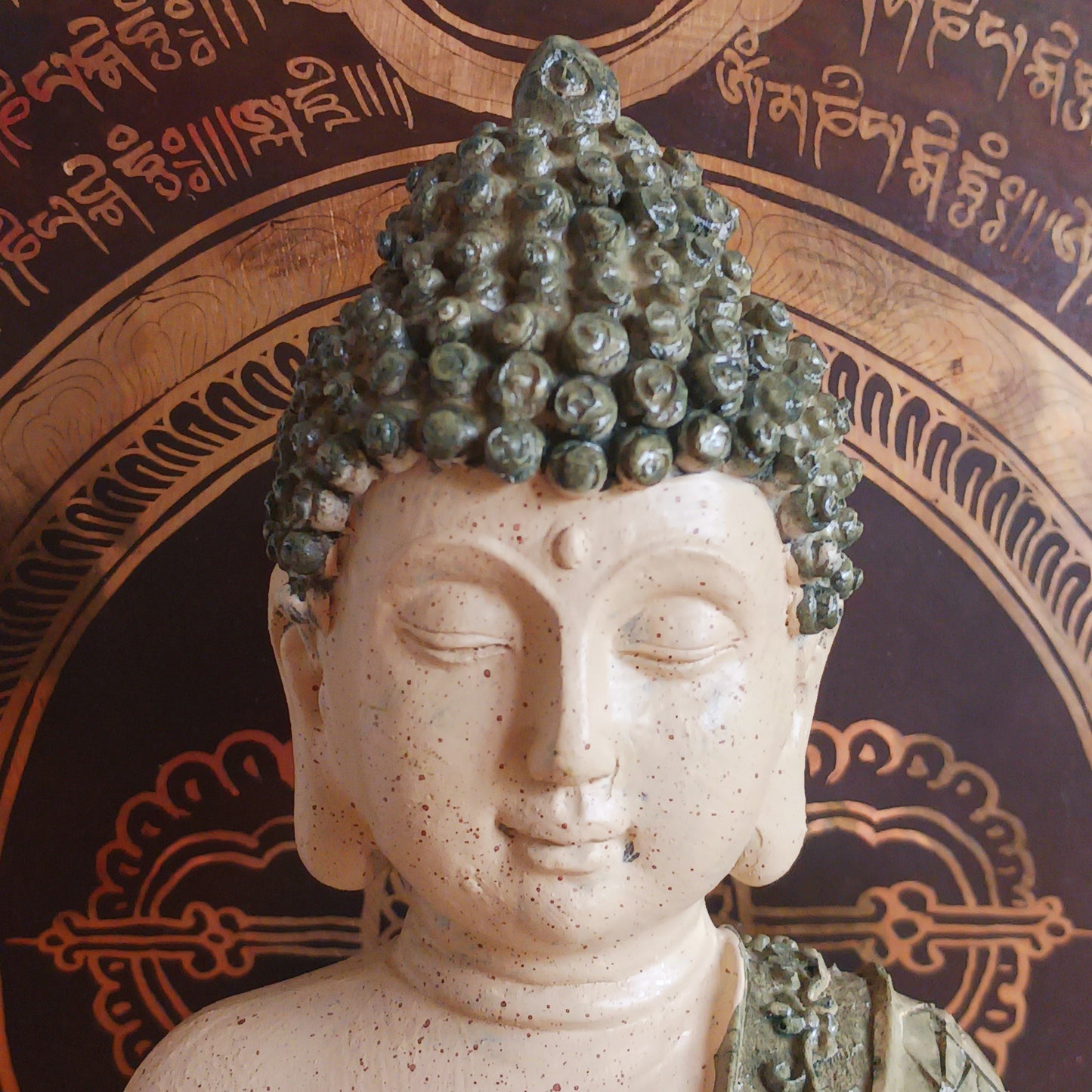 Invite peace and mindfulness into your space with this Buddha statuette, featuring a calming green mosaic pattern. Seated in the classic meditation pose with a tranquil expression, this modest figure is perfect for a shelf, home altar, or personal meditation corner. 