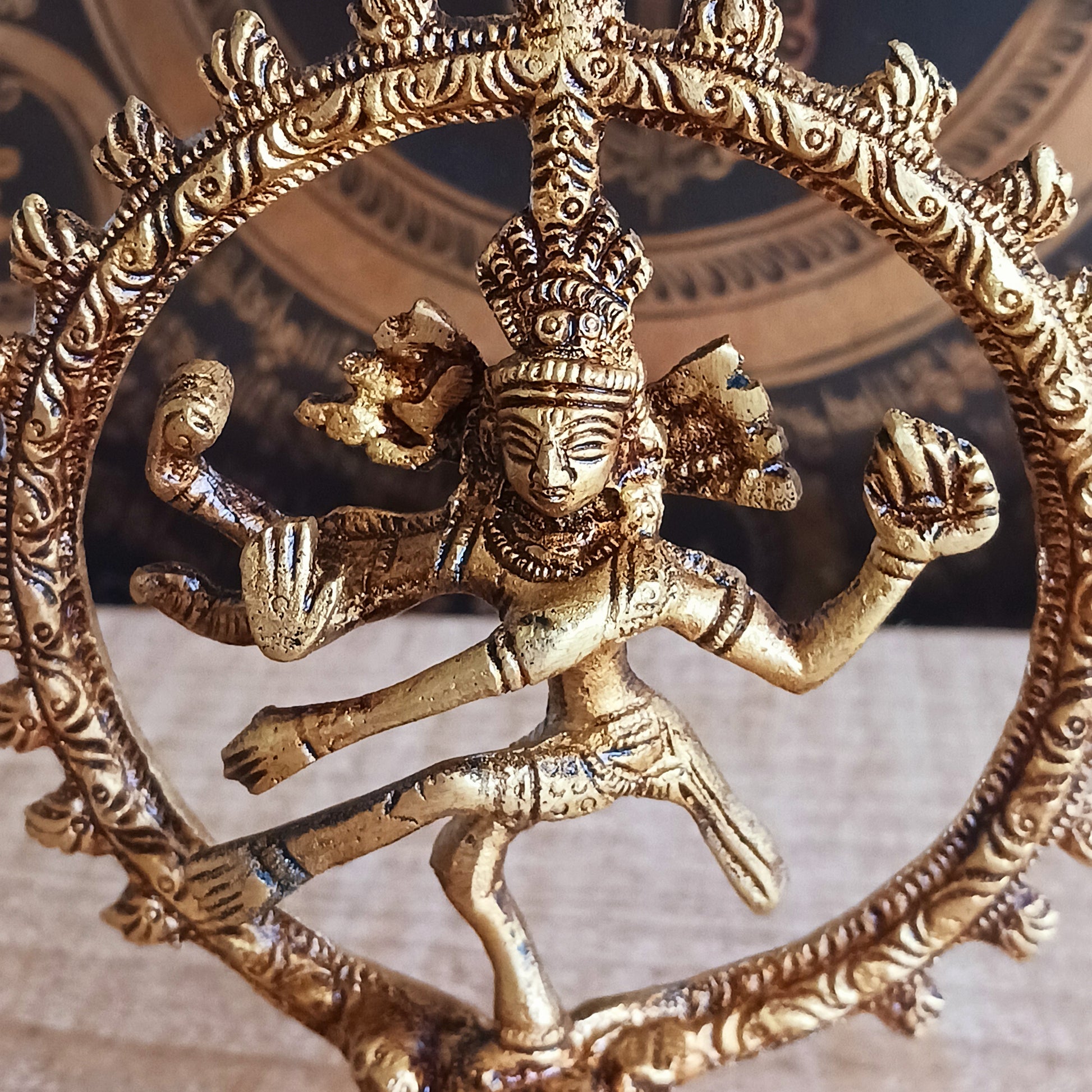 Invite balance, protection, and divine energy into your space with this beautifully crafted Brass Shiva Nataraja Statue. Cast in solid brass, this small yet striking sculpture captures Shiva in his cosmic dance—Nataraja, the King of Dance—symbolizing the ever-moving universe and the eternal cycle of creation, destruction, and renewal.