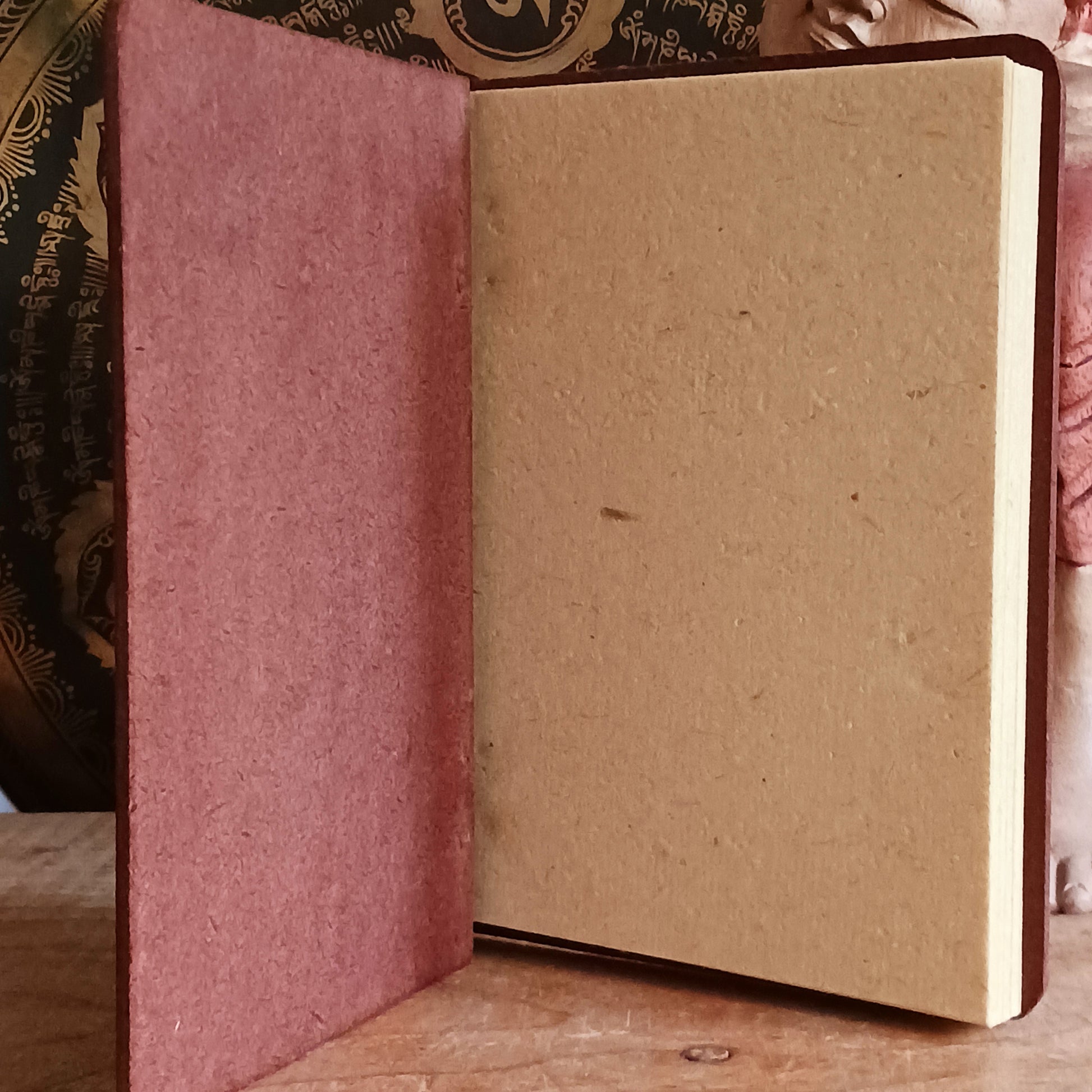 Capture your thoughts, ideas, and inspirations in this beautifully crafted hard-covered notebook. Featuring a hinged design and filled with eco-friendly recycled Lokta paper, it’s perfect for jotting down notes on the go. Each notebook is elegantly engraved with the Om symbol on the front cover, adding a touch of mindfulness and serenity to your writing. Ideal for journaling, sketching, or as a thoughtful gift for loved ones.