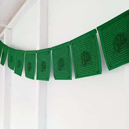Invite the blessings of Green Tara, the Bodhisattva of Salvation, into your home or sacred space with this vibrant string of 10 prayer flags. Known for her swift and compassionate energy, Green Tara helps release fears, overcome challenges, achieve goals, and protect against negative influences.