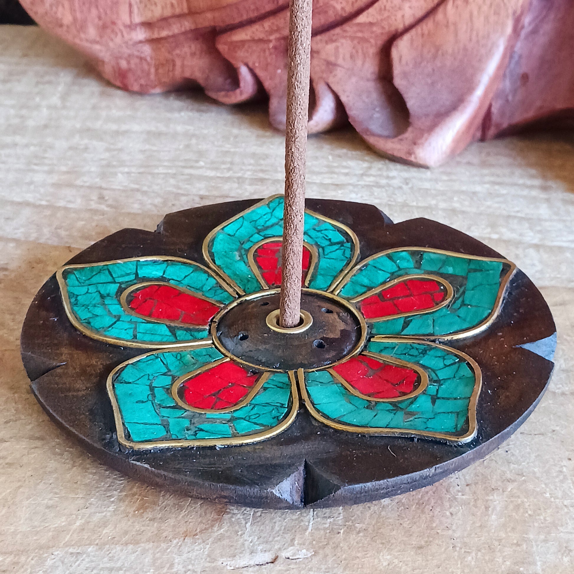 Elevate your incense rituals with these beautifully handcrafted wooden incense burners featuring intricate stone inlay designs. Each piece is made by skilled artisans, giving every burner a unique character—small imperfections are natural and celebrated as part of its handmade charm.