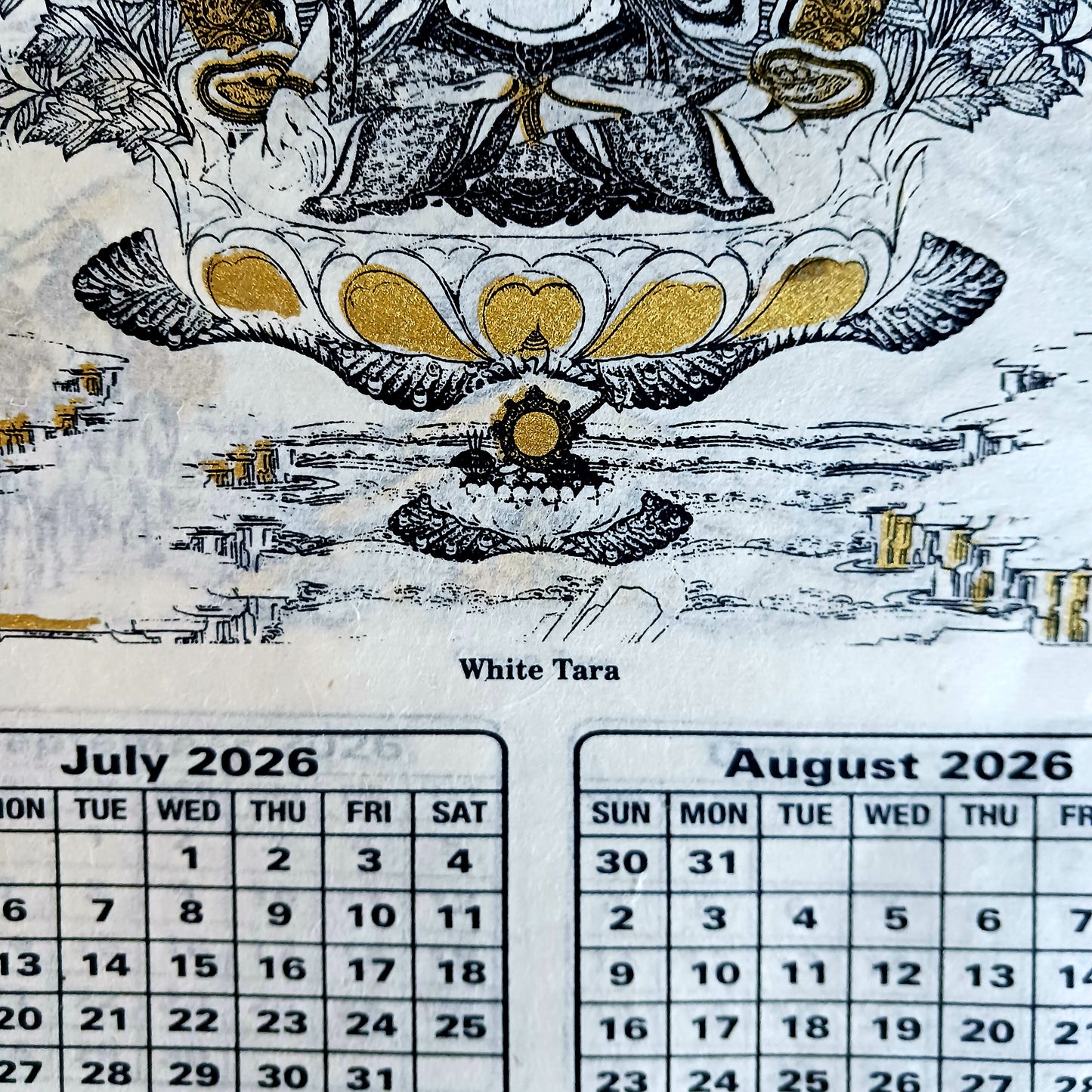 Bring the beauty, wisdom, and serenity of Buddhist art into your home with this handmade Lokta paper wall calendar, featuring seven revered Buddhist deities illustrated in traditional Thangka style. Each page showcases one of the following sacred figures: