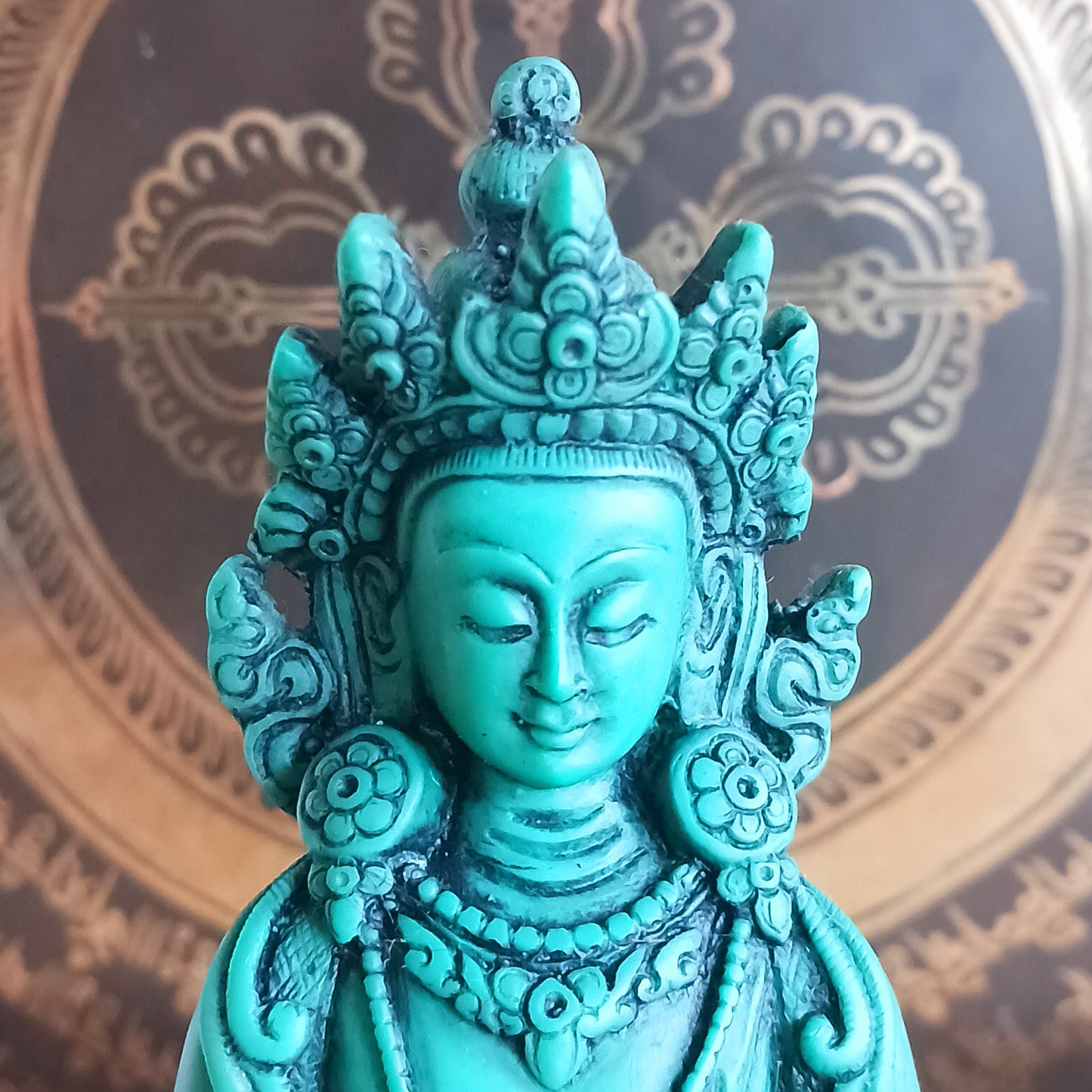 White Tara is known for compassion, long life, healing and serenity and is shown here with her right hand in the varada mudra (blessing pose.) White Tara is distinct from the more commonly seen Green Tara. She is seated in a tranquil, full lotus position as opposed to Green Tara's one foot extended pose. These intricate resin statues are carefully handcrafted in Nepal.