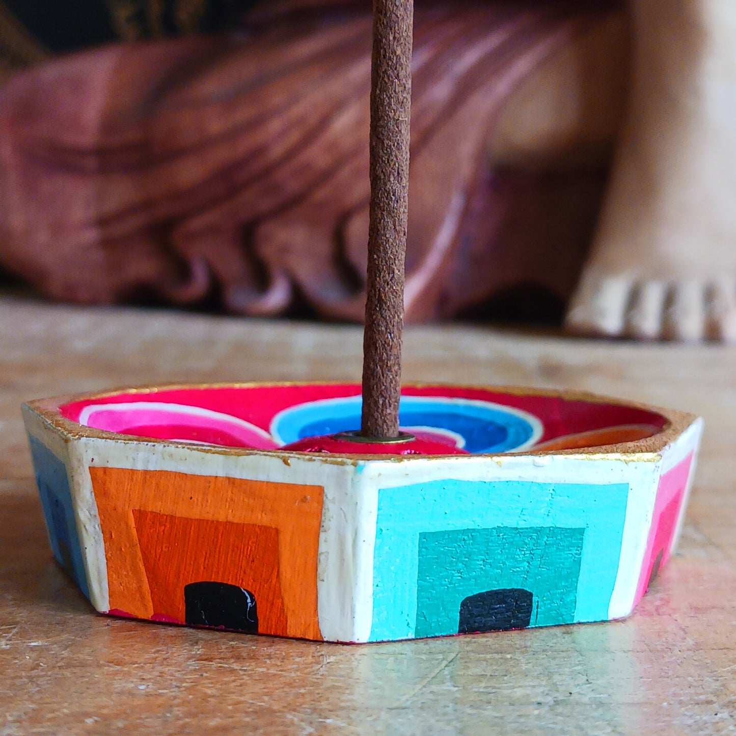 A beautiful little handcrafted Tibetan Incense stick holder, Hand painted and ethically sourced this incense holder is perfect for the larger Tibetan incense and also has 4 small holes for Indian sticks.