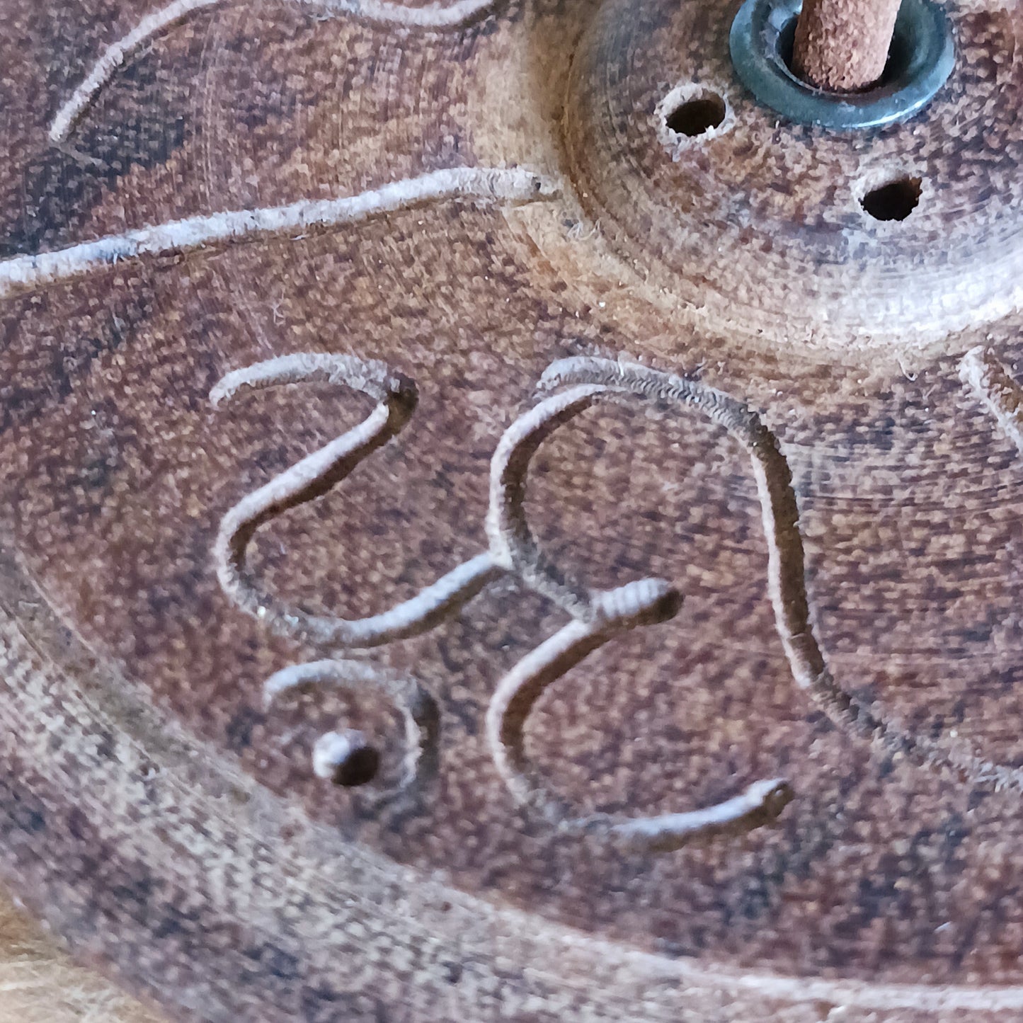 Bring a touch of serenity and spiritual elegance to your space with this handmade dark wood incense holder. Carefully carved by skilled artisans in Nepal, each holder features intricate OM symbols, representing peace, harmony, and mindfulness.