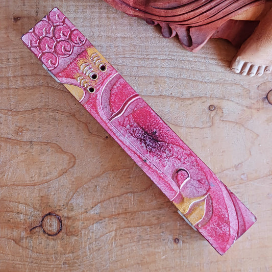 Create a calm, aromatic atmosphere in your home with this beautifully handcrafted Buddha incense holder. Made from responsibly sourced wood, this unique piece features a delicately hand-carved Buddha head, making it both a functional incense burner and a decorative spiritual accent.