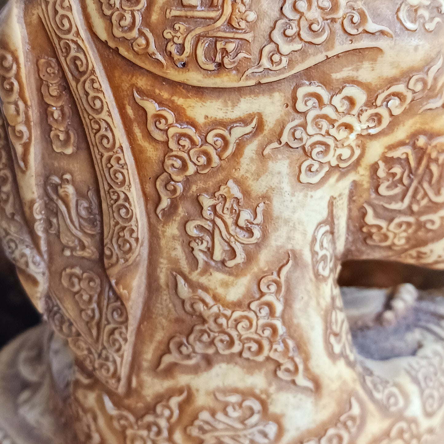 Bring serenity and wisdom into your space with this large, intricately detailed Buddha statue. Cast in a deep sand colour, this statue depicts the Buddha in the Dharmachakra Mudra — the "Wheel of Dharma" gesture. 