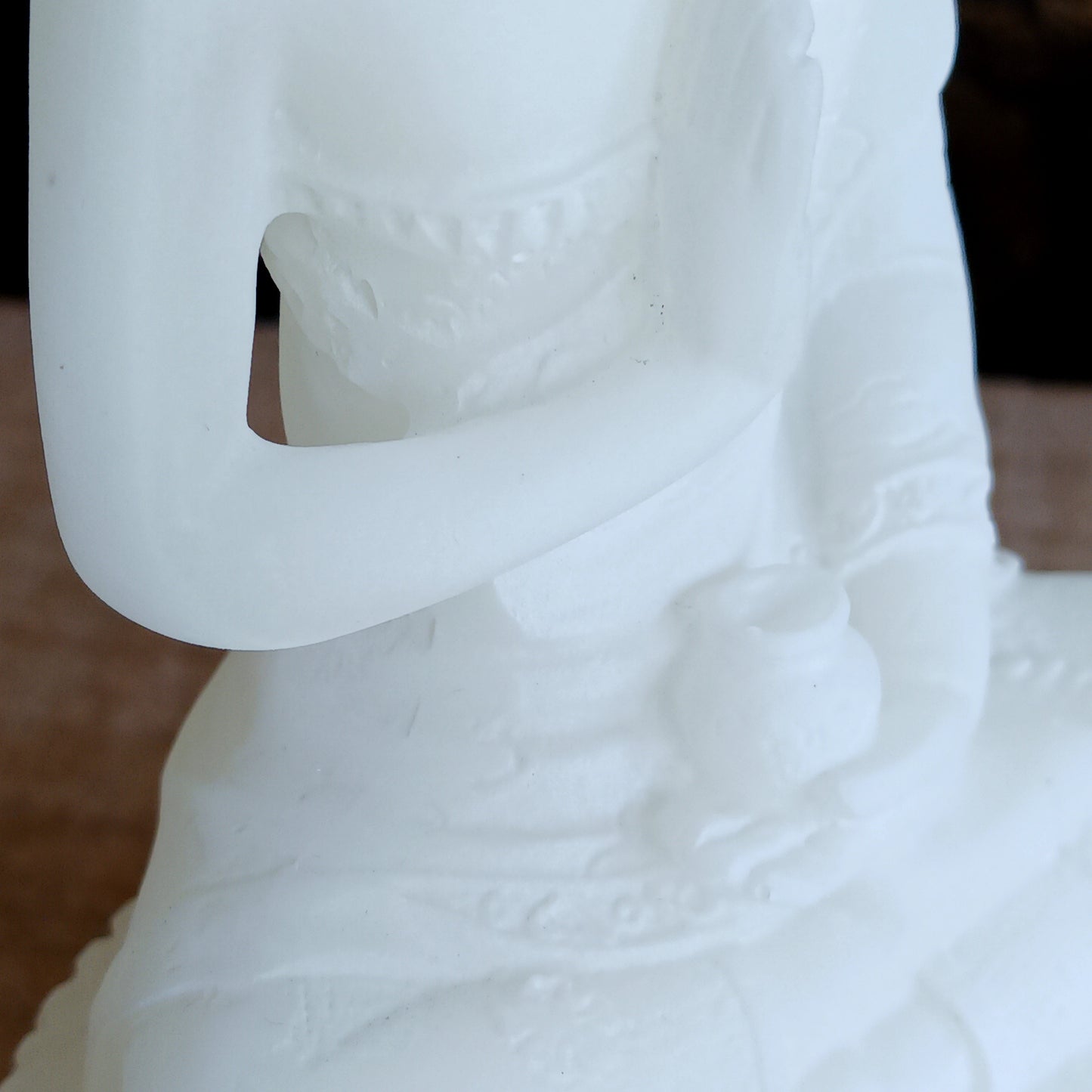 Bring serenity and spiritual symbolism into your sacred space with this beautifully crafted 16cm White Buddha Statue, complete with an Amrita vase. Handmade in Tibet, this statue reflects traditional Buddhist artistry and carries deep meaning rooted in ancient Sanskrit.