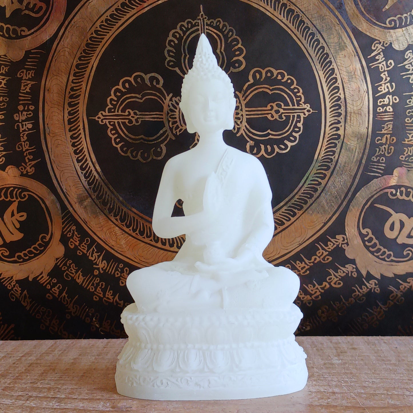 Bring serenity and spiritual symbolism into your sacred space with this beautifully crafted 16cm White Buddha Statue, complete with an Amrita vase. Handmade in Tibet, this statue reflects traditional Buddhist artistry and carries deep meaning rooted in ancient Sanskrit.