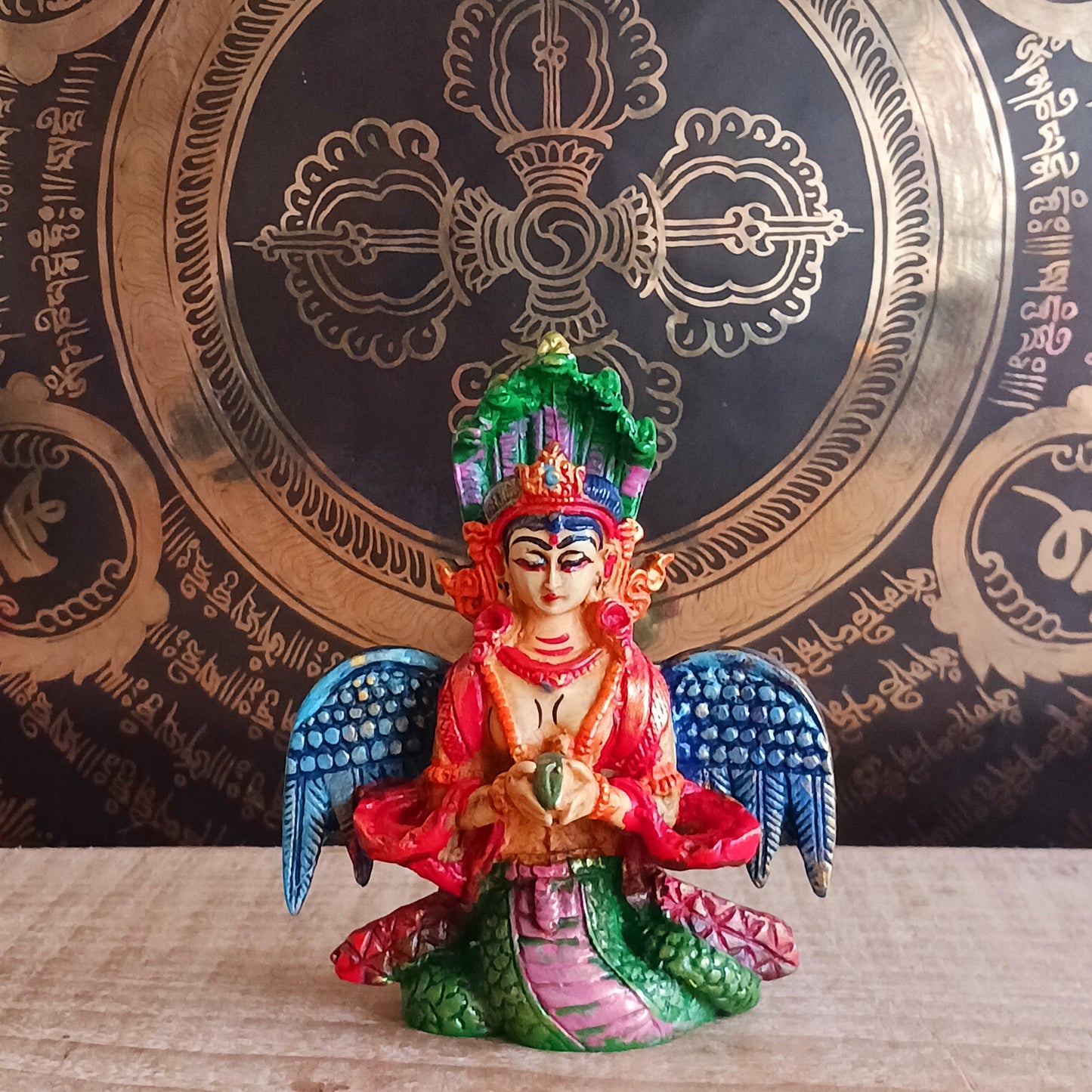 Bring home the mystical charm of the Naga Kanya with this handpainted statue, crafted in vibrant, eye-catching colours. Known as the “Snake of the Rainbow” or the daughter of the serpent, Naga Kanya is revered as a benevolent goddess who protects treasures and guides devotees across the three realms.