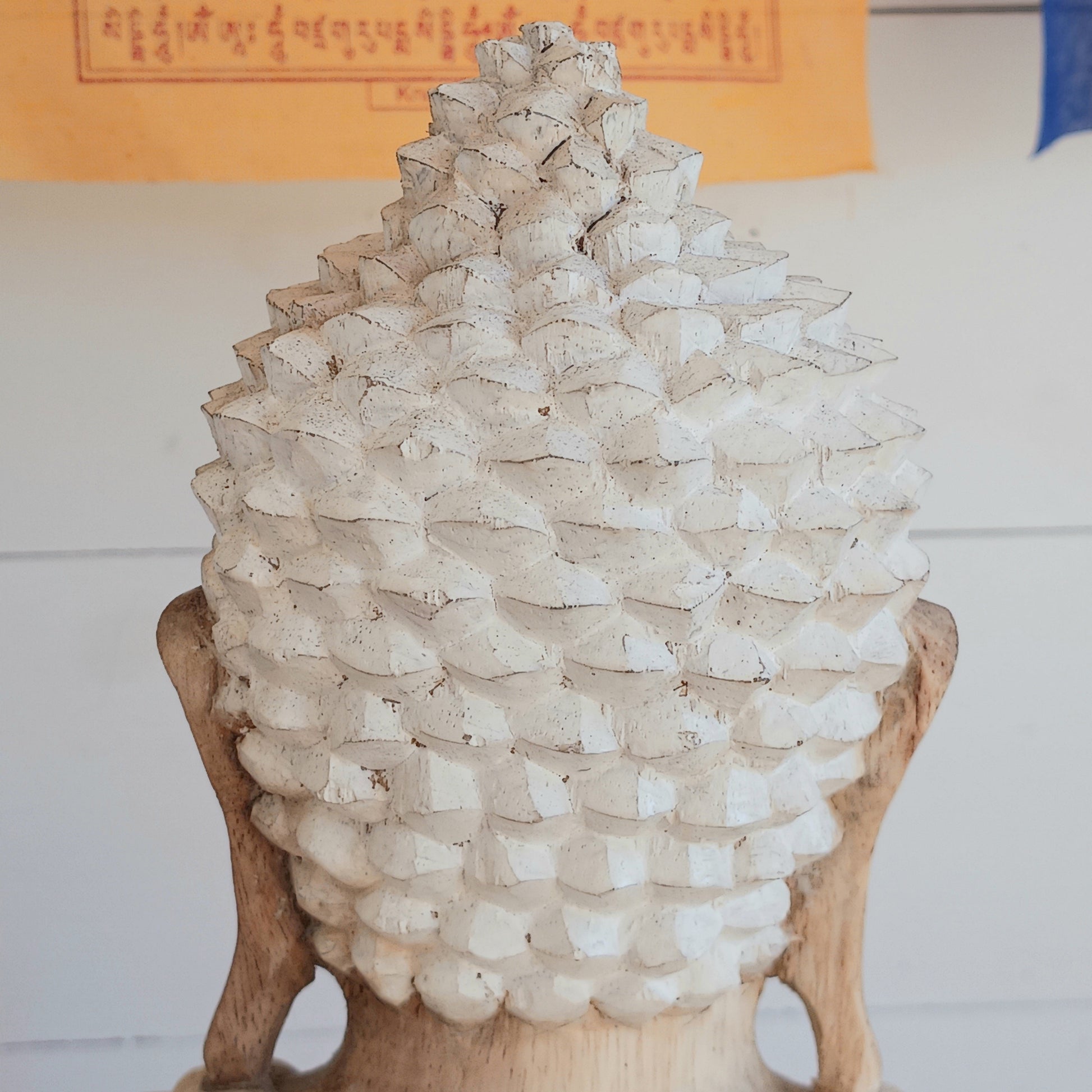 Bring calm, wisdom, and mindful intention into your space with this beautifully serene Teaching Buddha statue, hand-carved from sustainable Suar wood (Albizia Saman), a fast-growing and responsibly cultivated hardwood, finished in whitewash.