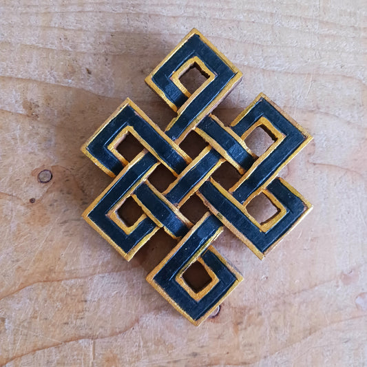 The Eternal (or Endless) Knot is one of the Eight auspicious symbols in Tibetan Buddhism. Because the knot has no beginning and no end, the eternal knot symbolizes the endless wisdom and compassion of the Buddha.