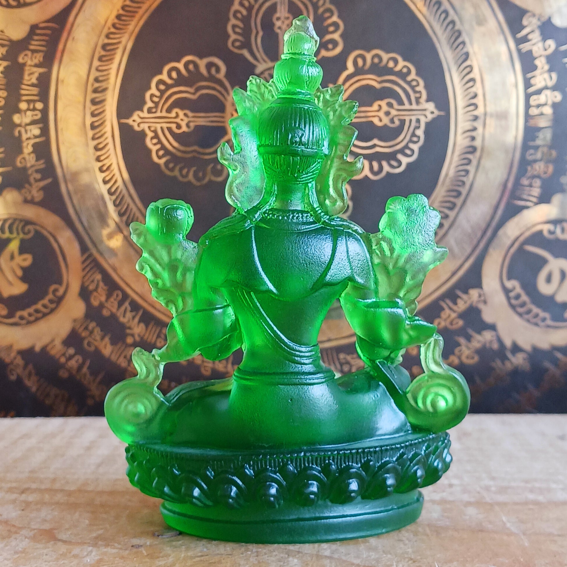 Bring serenity and divine feminine energy into your space with this stunning transparent Green Tara statue, crafted from high-quality glazed glass. Known as the "Mother of all Mothers," Green Tara represents compassion in action. Her graceful posture—one leg extended—symbolizes her readiness to help all beings instantly.
