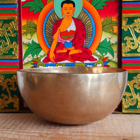 Elevate your meditation and sound healing practice with this Classic Hand-Hammered Singing Bowl, beautifully engraved with the sacred OHM symbol inside the bowl. This is a unique, one-of-a-kind item—you will receive exactly the bowl pictured.