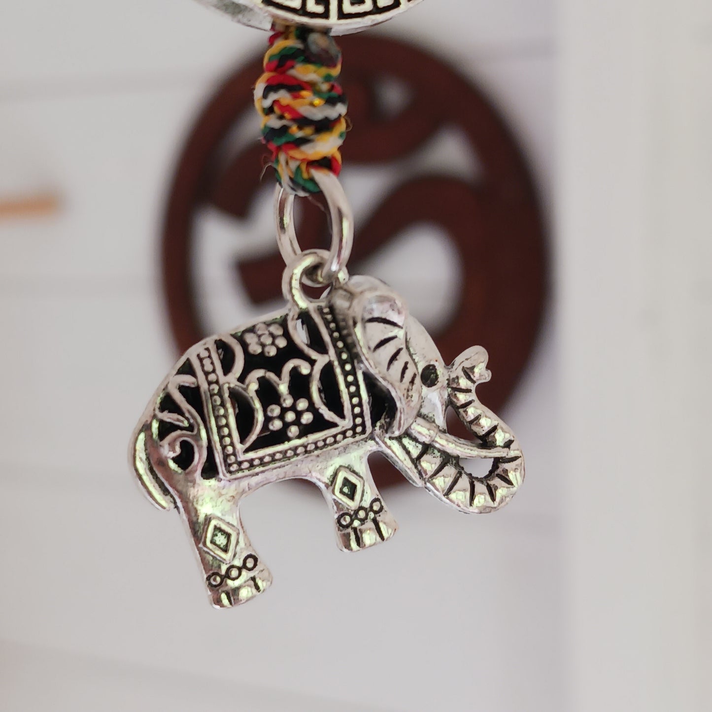 Bring peace, protection, and powerful symbolism wherever you go with this Buddhist protective pendant. Featuring the Double Dorje, a sacred symbol of stability, strength, and protection from fear, and an Elephant, representing the transformation of desire into mindfulness and contentment, this pendant is a meaningful accessory for your car, home, bag, or key ring. Crafted with intention, it's a perfect reminder of your inner strength and spiritual focus.