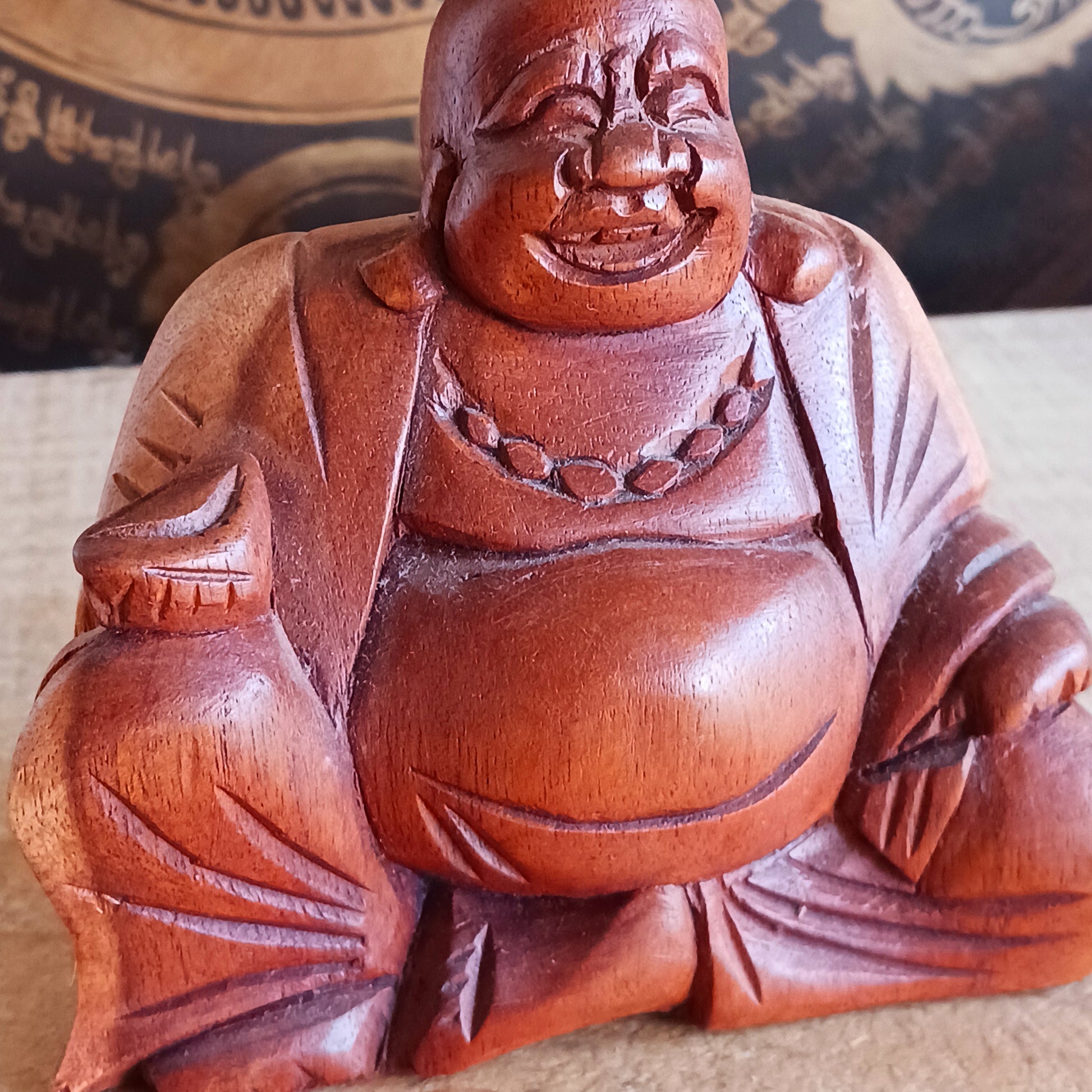 Bring joy and good fortune into your space with this exquisite little hand-carved Laughing Buddha statue. Known as Budai in Chinese culture, this beloved figure represents contentment, abundance, and spiritual well-being.