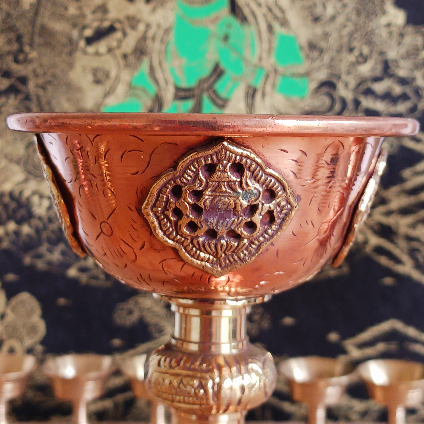 Illuminate your spiritual practice with this fine Traditional Tibetan Butter Lamp, handcrafted from high-quality copper and adorned with intricate Auspicious Symbols. These sacred lamps are a central element in Tibetan Buddhist rituals, symbolizing the light of wisdom dispelling the darkness of ignorance. Commonly found in Himalayan temples and monasteries, butter lamps are offered each morning by Tibetan Buddhists.