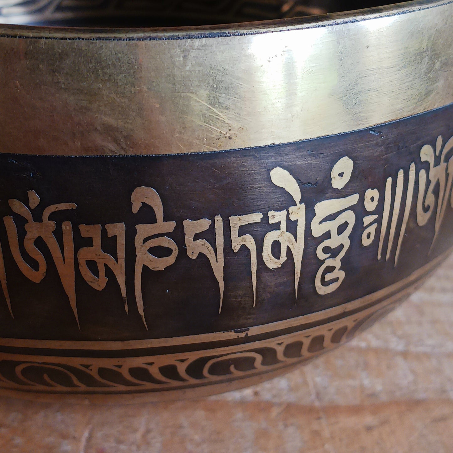 This beautifully crafted Tibetan Singing Bowl is machine made and delicately etched with the sacred Om Mantra, symbolizing universal connection and inner peace. Each bowl is unique in its artistry and design. Traditionally used for meditation and healing, singing bowls help restore harmony between body, mind, and soul.